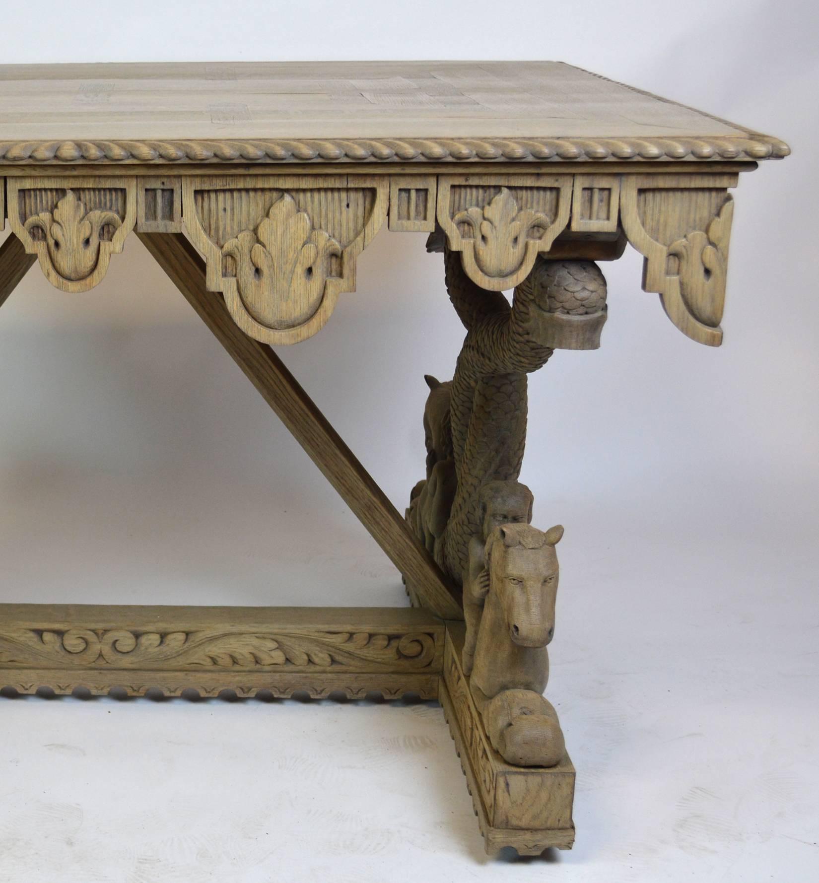 Solid oak Renaissance Revival trestle table which features carved trestle ends depicting putti (cherubs) riding sea horses, united by a carved stretcher. Tabletop of parquetry inlay with a carved rope edge and a wildly carved scalloped apron. Table