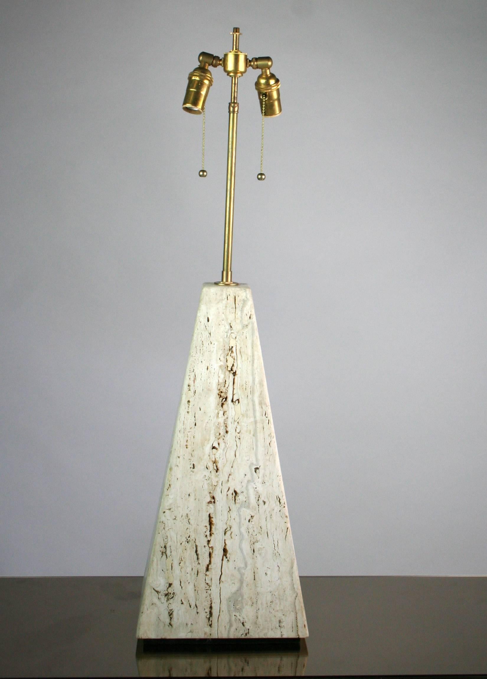 An Italian travertine lamp of obelisk form with new brass double cluster sockets and cloth cord. signed on a brass plaque "H.R." Base is 10" square x 20" tall. Overall height is 34 1/2". Shade for display only.