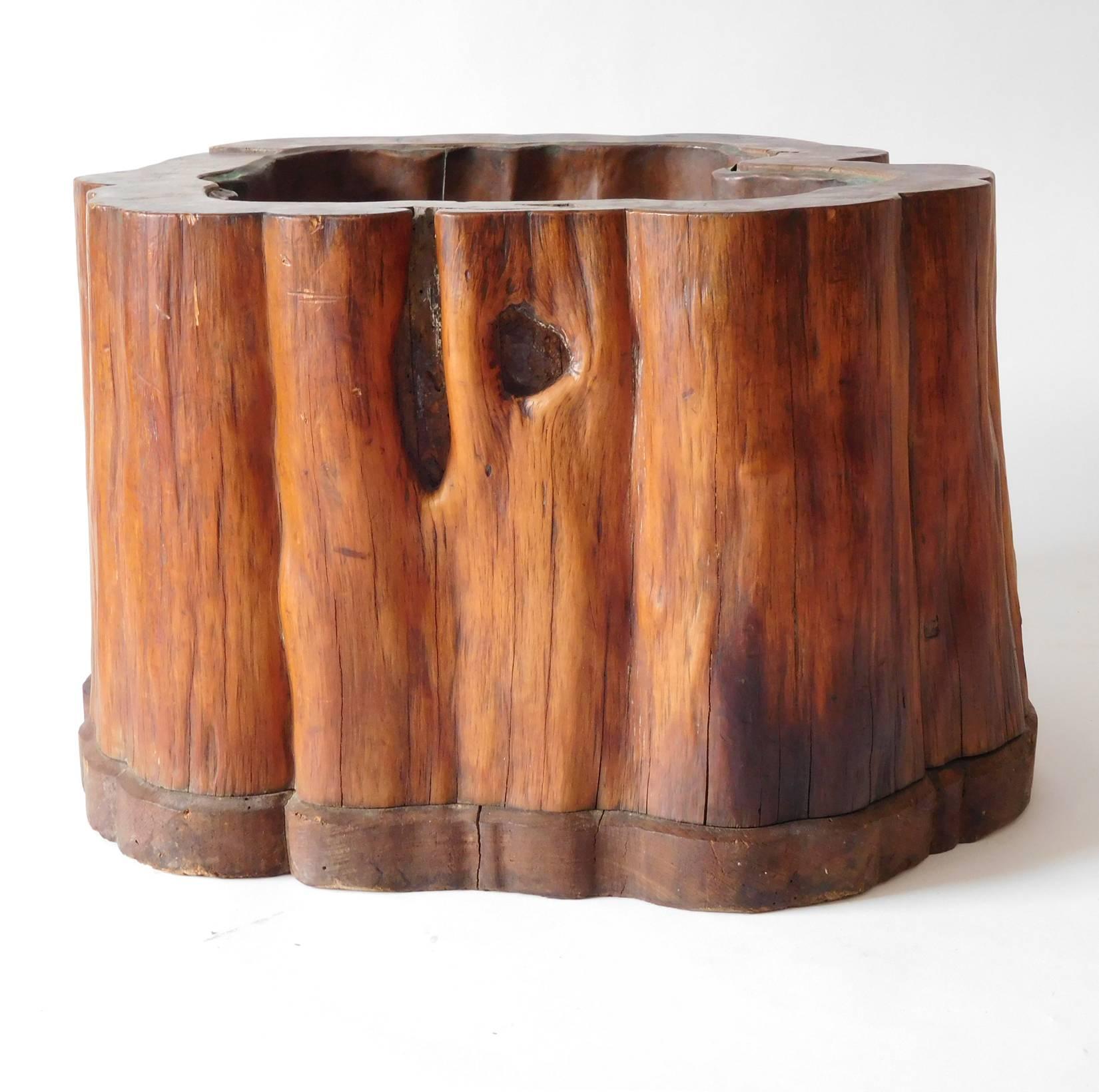 Two antique burl wood hibachi with copper liners. Each piece has is attached to its wood stand which was crafted to follow the contour lines of the burl. The copper liners are fitted to the contours of wood as well. Unique and highly desirable. Sold