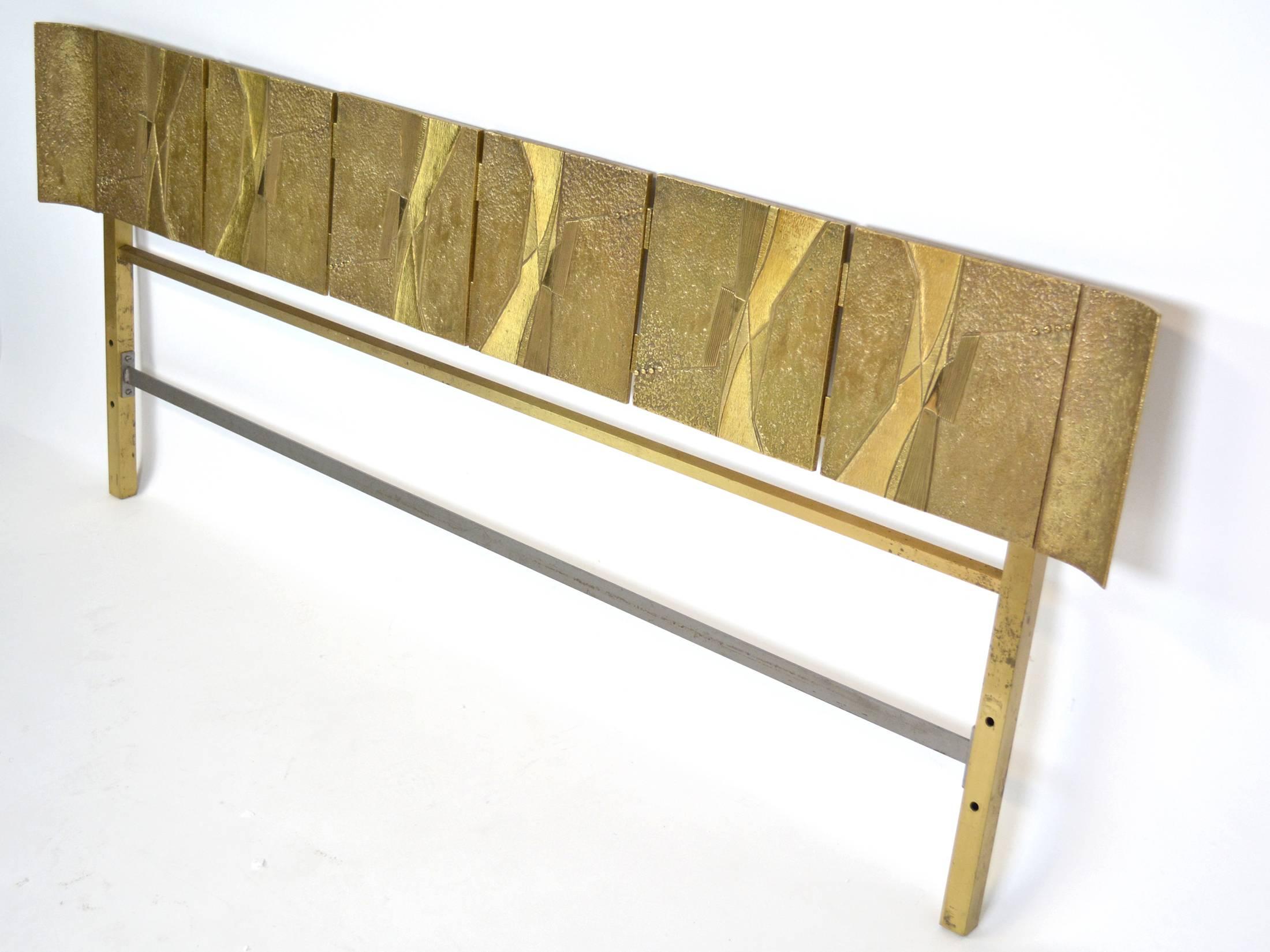A bronze headboard by Luciano Frigerio, Italian, circa 1960, composed of six cast bronze panels flanked by curved panels on each end.