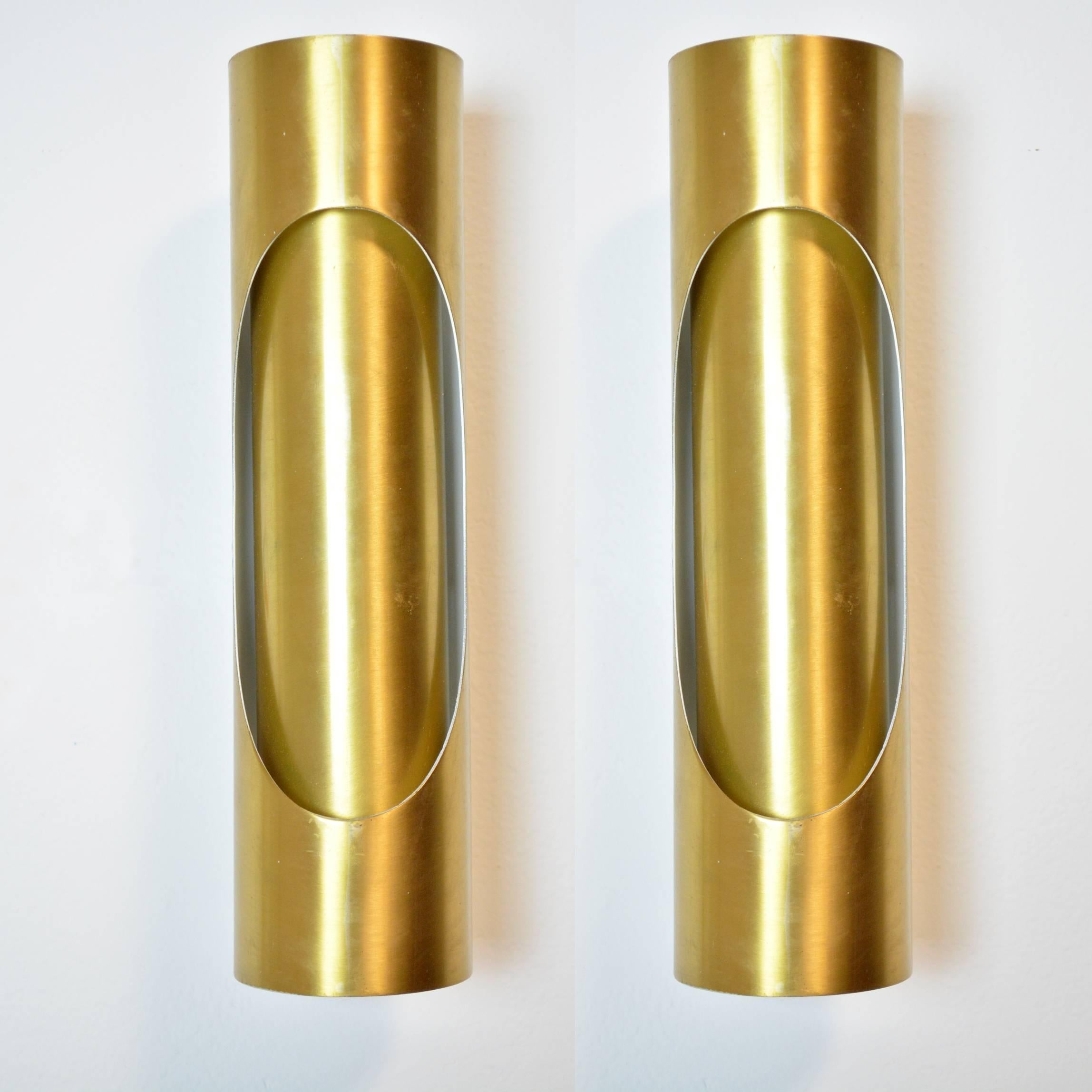 A pair of Spanish gold-tone metal tubular sconces, with two Edison base sockets. Newly wired for US use, with new painted backplates. Two pairs of sconces available. Similar in style to fixtures from the era by RAAK and Romeo Rega.

Two sets of