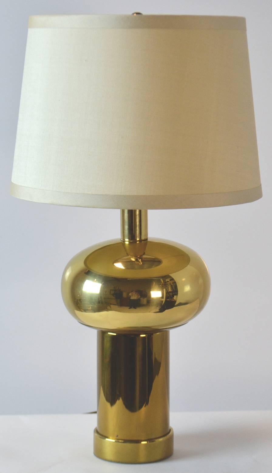 Pair of 1970s modernist brass lamps with Art Deco influence. A flattened sphere on a thick column with a ring base. Attributed to Westwood Industries. Shades for display only.