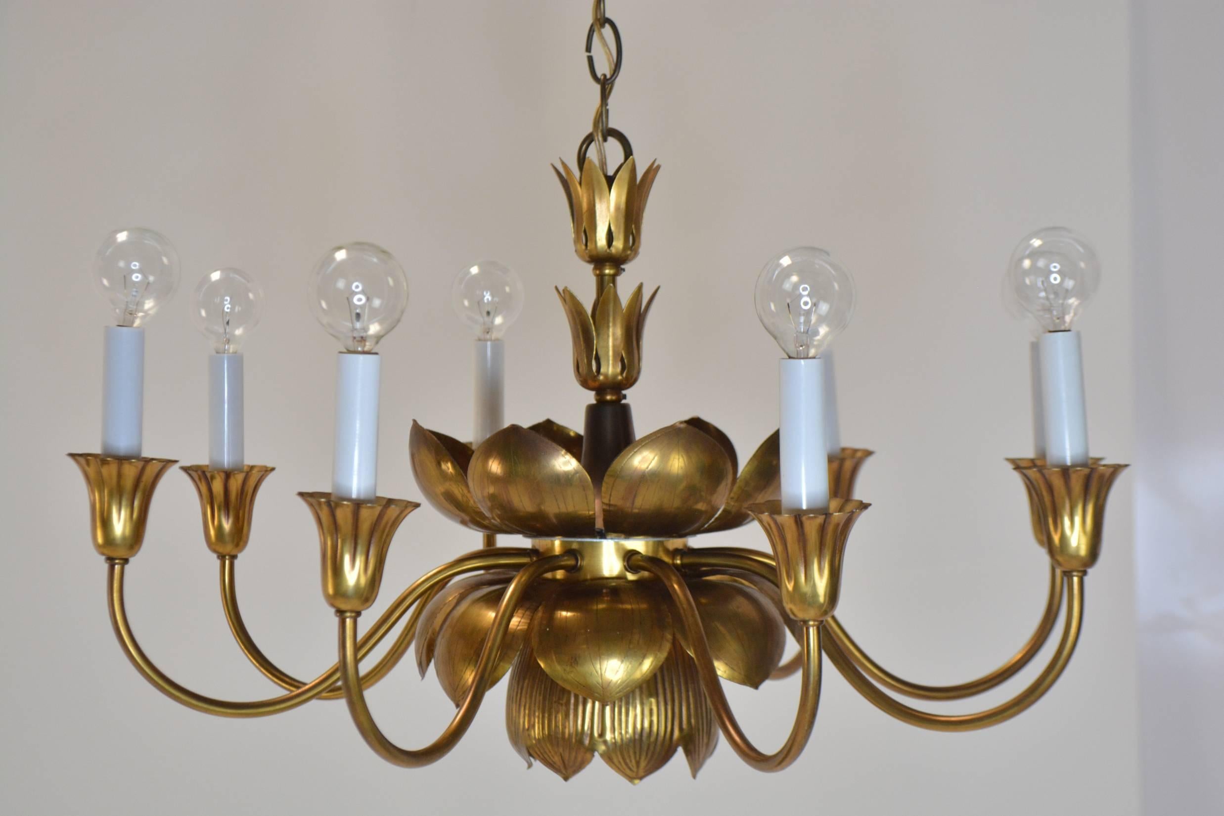 A sculptural Lotus form chandelier by Feldman Company. Six arms and sockets hold 25 W candelabra base bulbs, with a downlight in the central lotus flower. Rewired with new sockets.