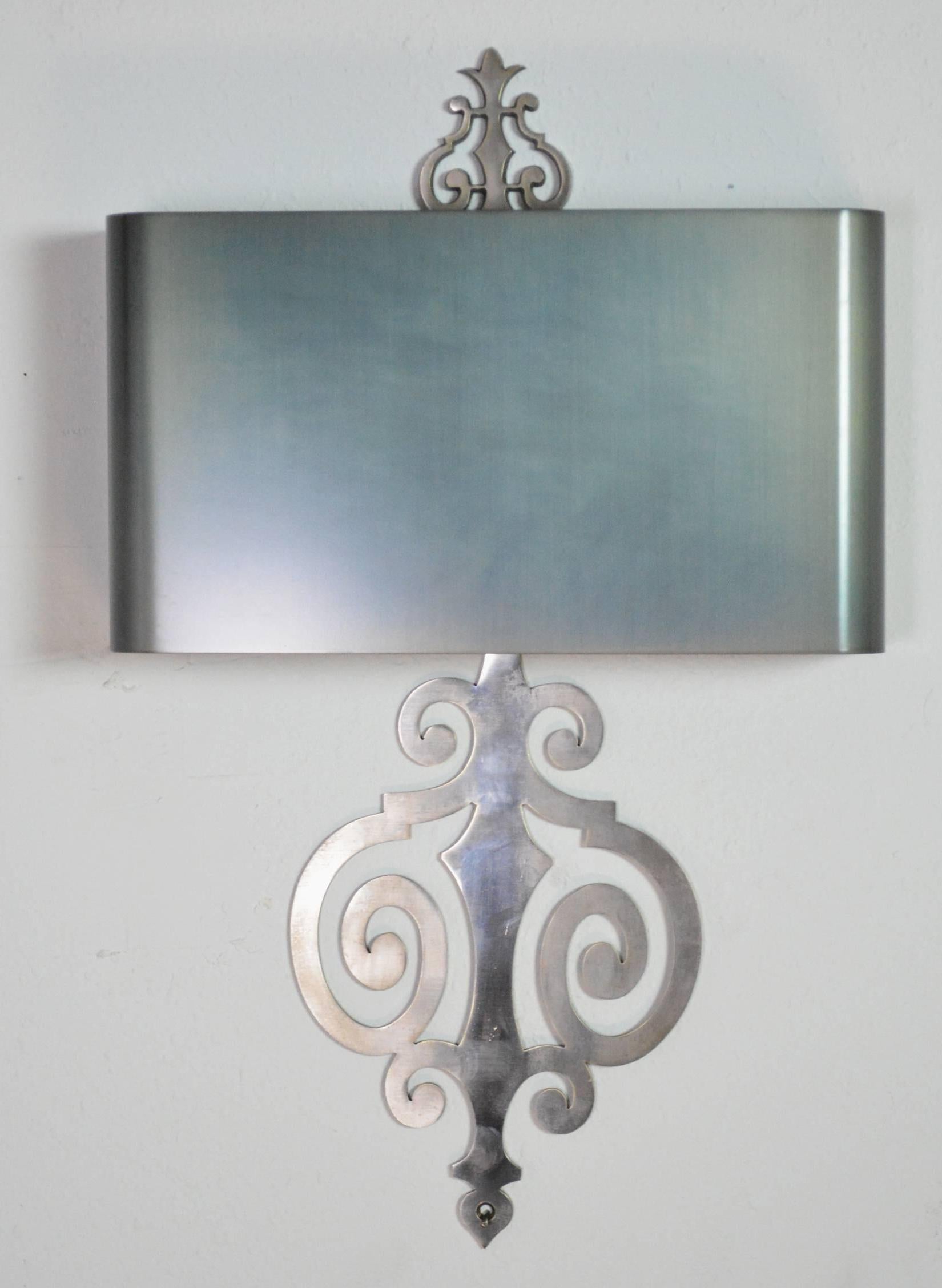 A chic pair of Maison Charles French sconces in steel. Steel shades with a dark steel finish.