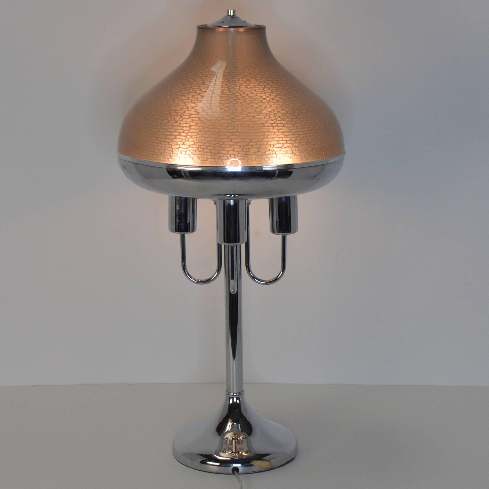 A sculptural Italian chrome lamp with four arms and sockets under a textured, smoked acrylic and chrome shade, on a central column with flared base. Large-scale for a real statement.