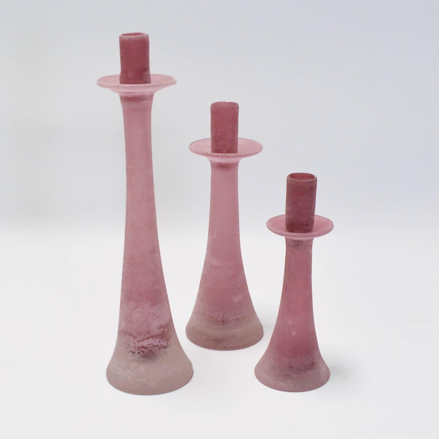 Lovely and rare pink Murano glass candle stick holders by Cenedes in the scavo technique. Signed.
Large 16.75" H Diameter 4.25"
Medium 13" H   Diameter 4.25"
Small 10.25"  H Diameter 3.75" 