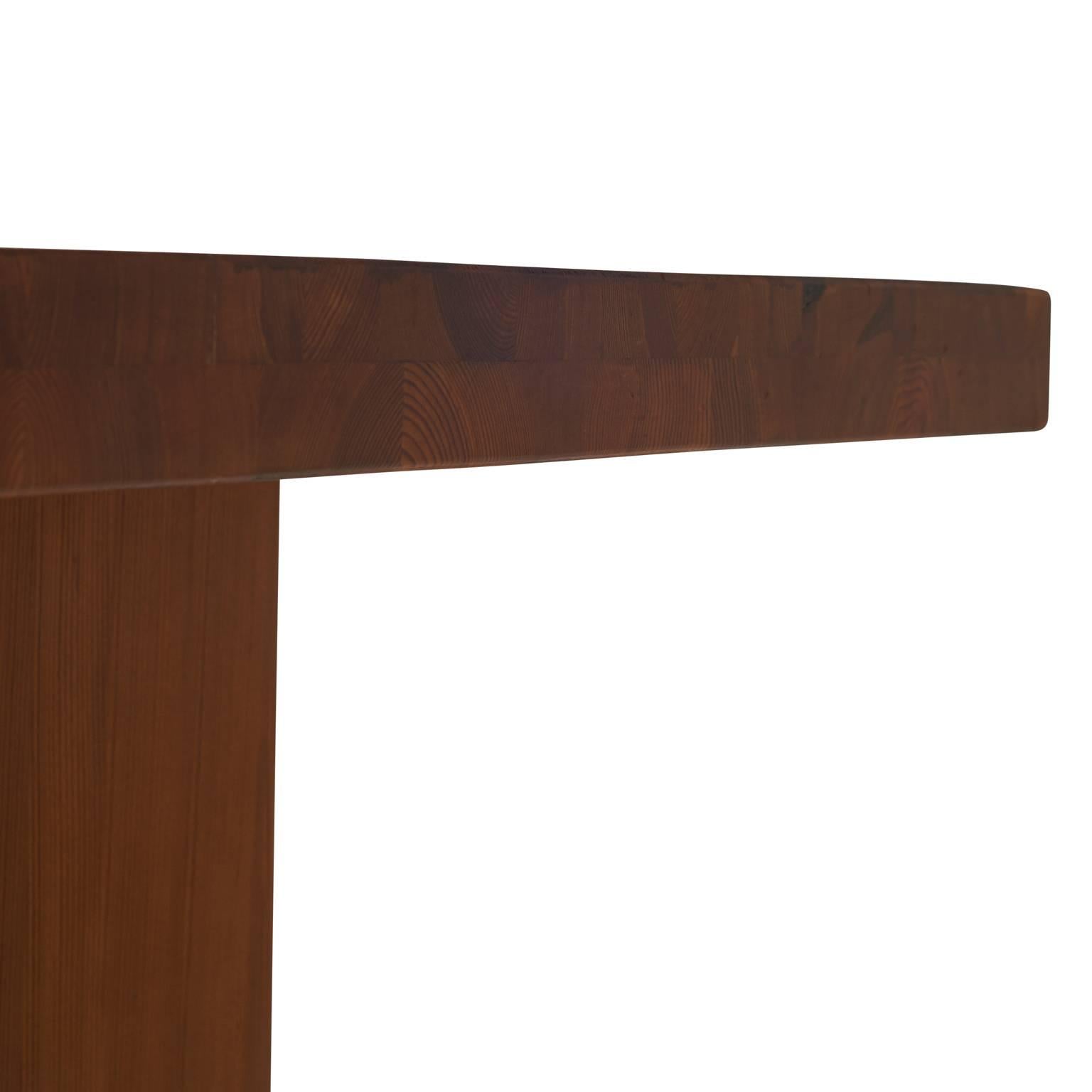 A dining table by Axel Einar Hjorth. Beautifully grained Oregon pine with a matte finish.