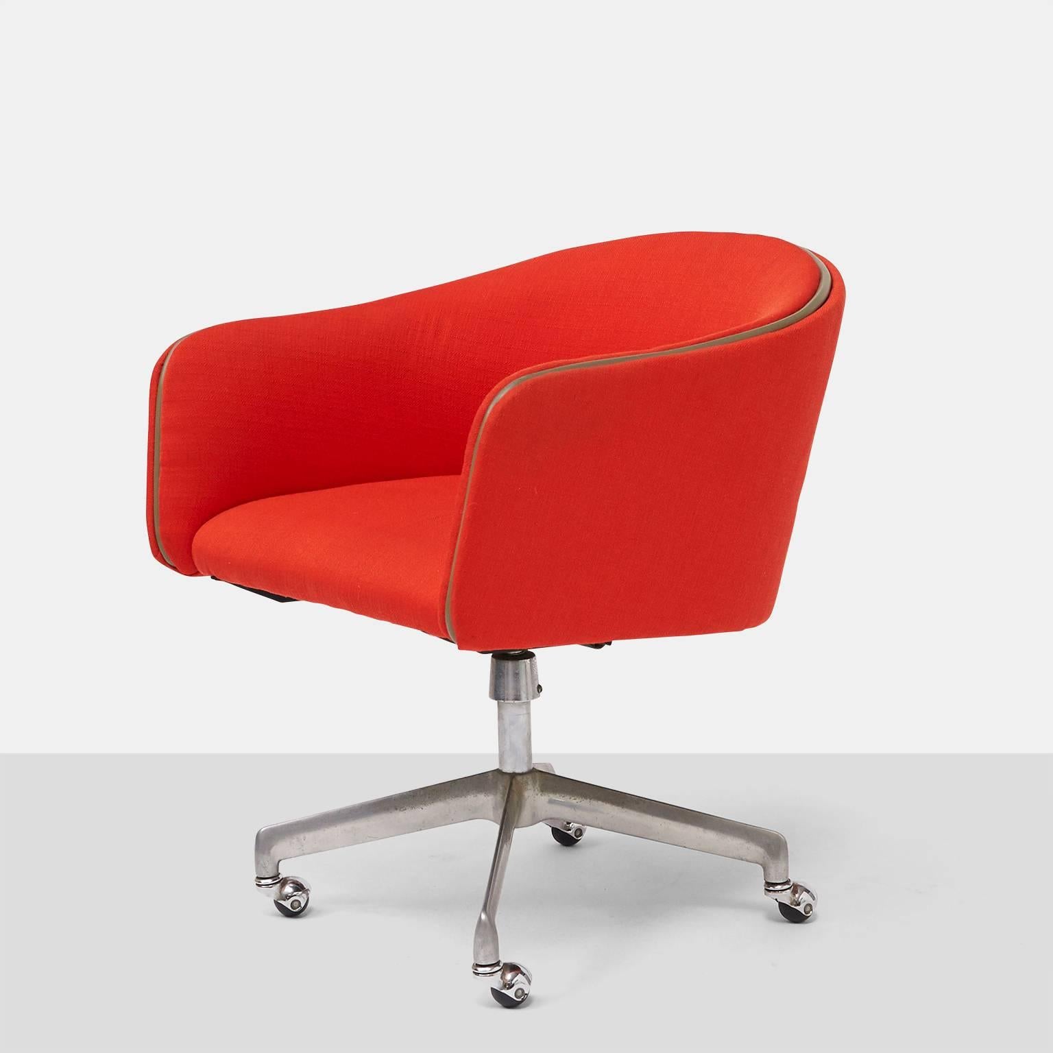 A swivel office chair by Alexander Girard. Base of four rollers.
