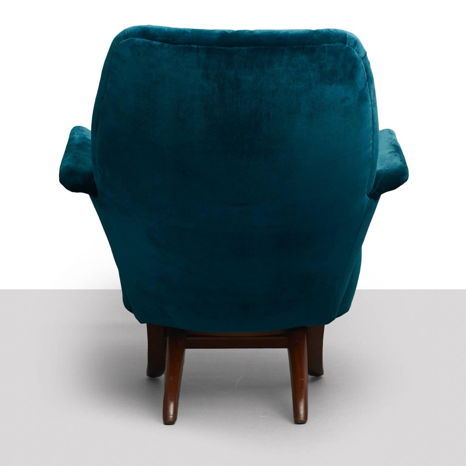 A penguin lounge chair by Theo Ruth for Artifort. A modular design comprised of two interlocking pieces, seat and back can separate. Newly restored in a peacock colored silk velvet, with two covered buttons and legs of mahogany.