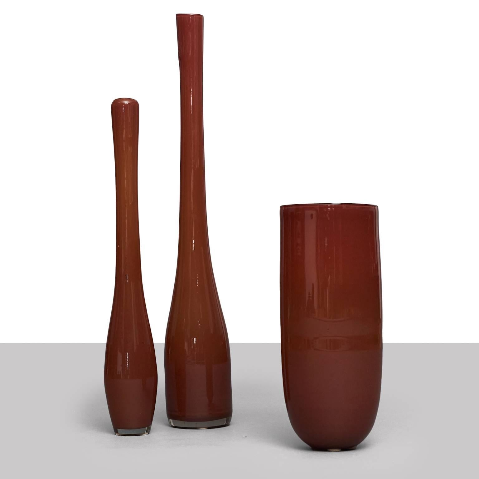 Three unique, handblown floor vases. The highest vase is about 36 inches high, which is nearly the maximum length one can achieve with mouth-blown glass. Limited edition.