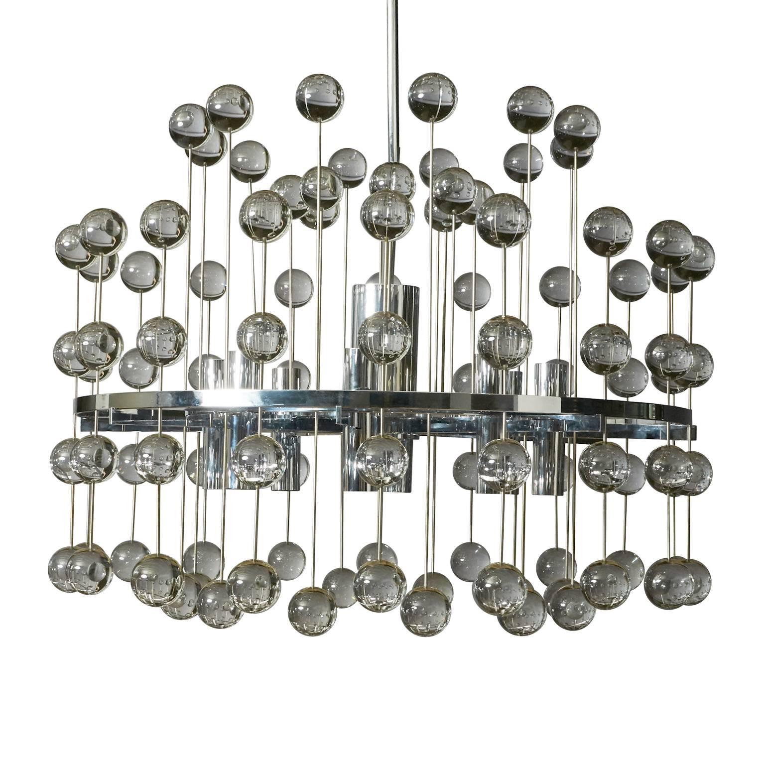A chandelier by Aloys Gangkofner. Chrome frame with glass balls in varying heights.