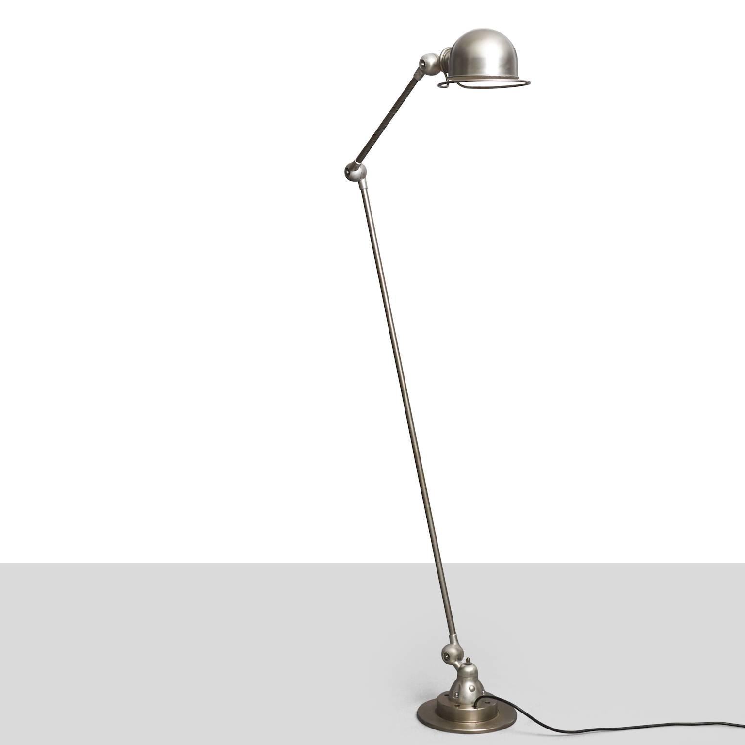 A Jielde Lyon standard lamp. Polished steel and aluminum with three rotating links. 
 