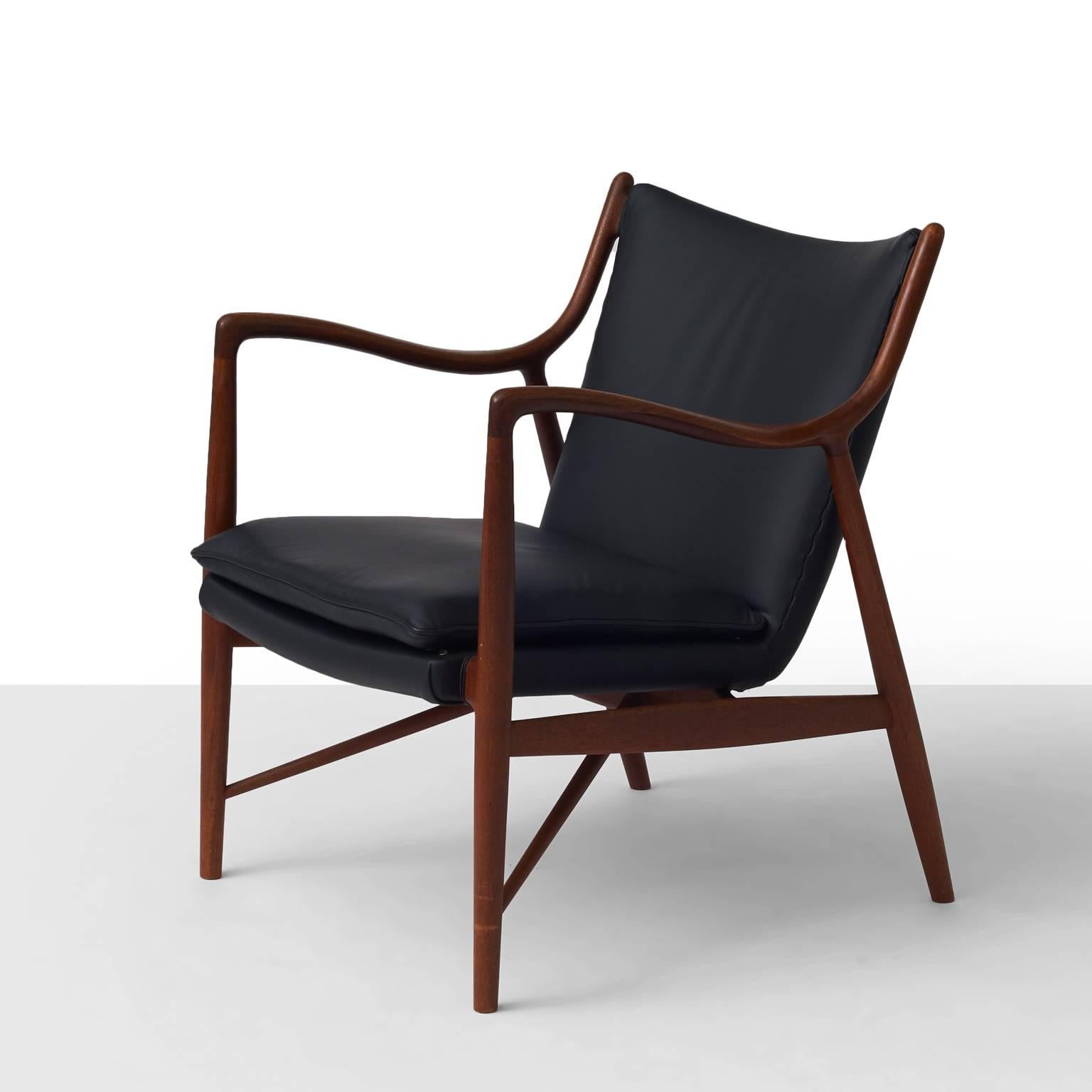 Model NV45 lounge chair designed by Finn Juhl/Niels Vodder. Exposed teak frame and leather upholstery. Stamped 