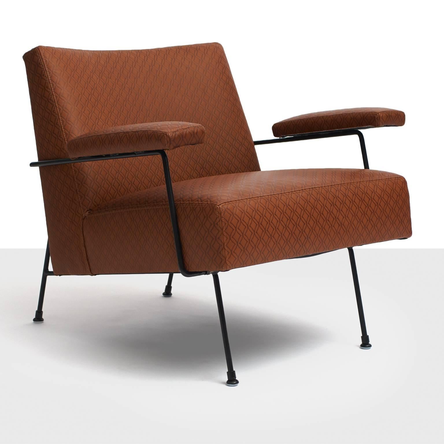 A pair of rare lounge chairs by Milo Baughman. Features a black iron frame. Restored in a custom-made embossed leather by Holland and Sherry. Manufactured by Pacific Iron Products, 1950.