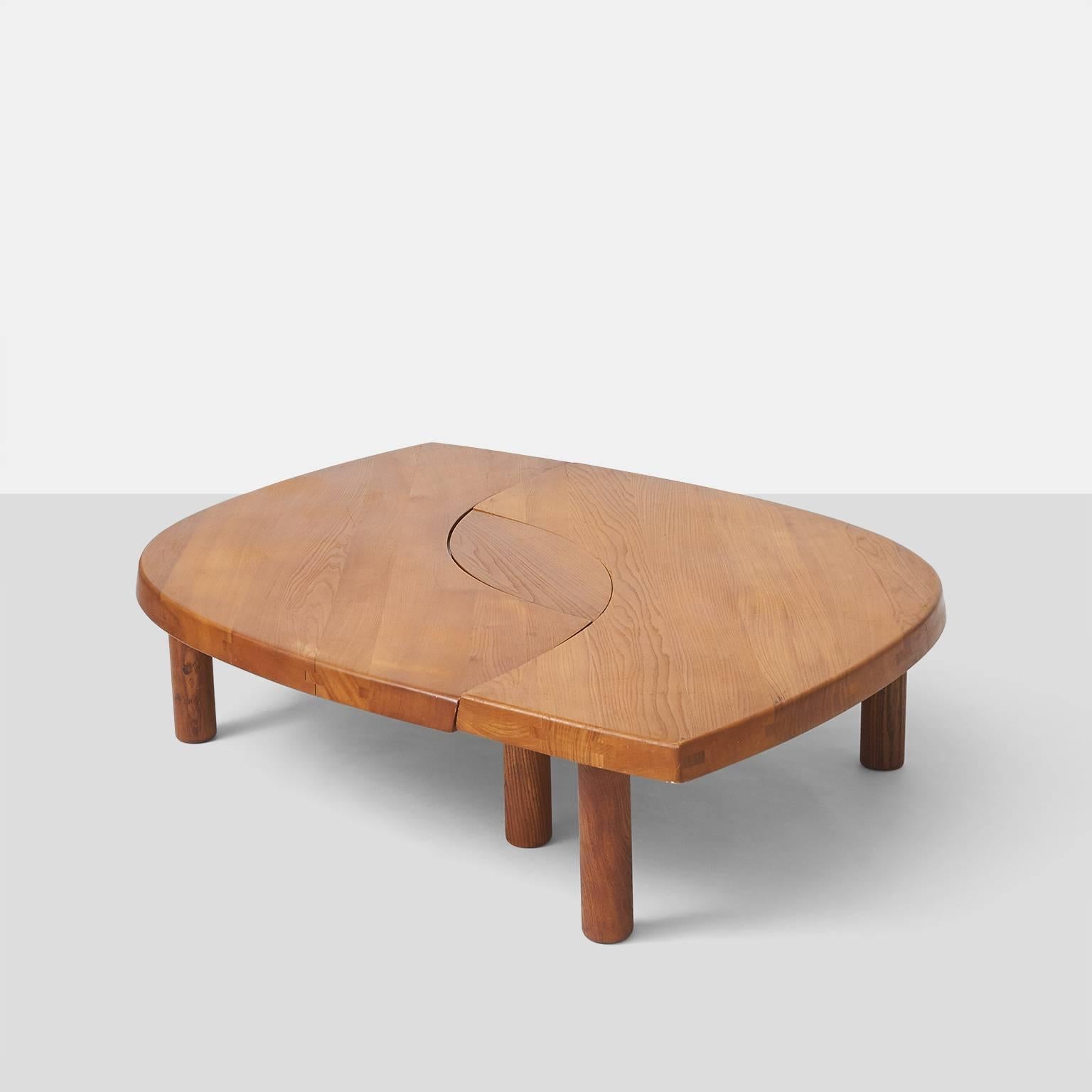 A coffee table in elm wood by Pierre Chapo. Unlimited arrangements allow this to be used a one or two different coffee tables as well as a bench. Beautiful original patina.