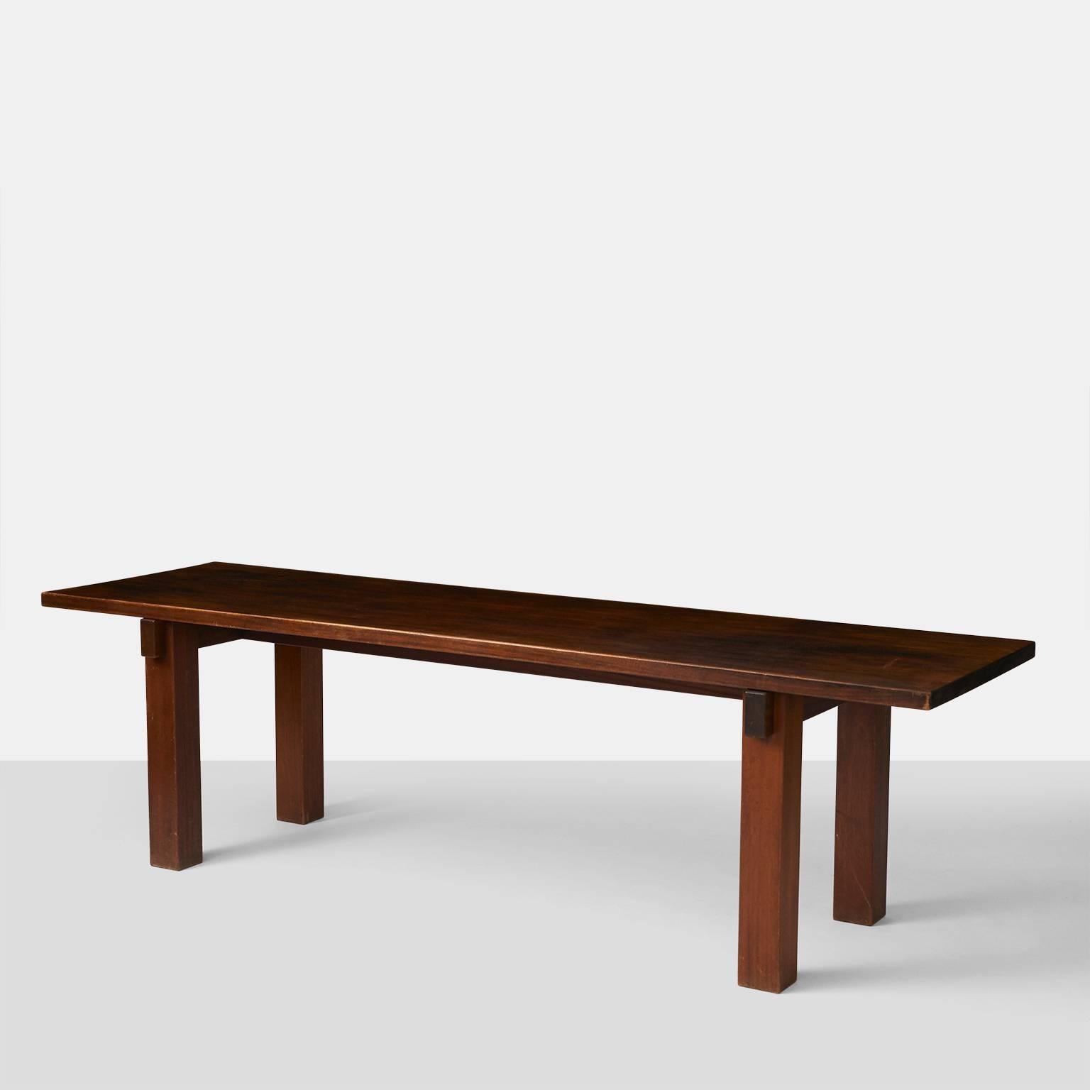 A very rare table in sapele mahogany by Charlotte Perriand which she used personally in her Rio de Janeiro apartment as a console table.