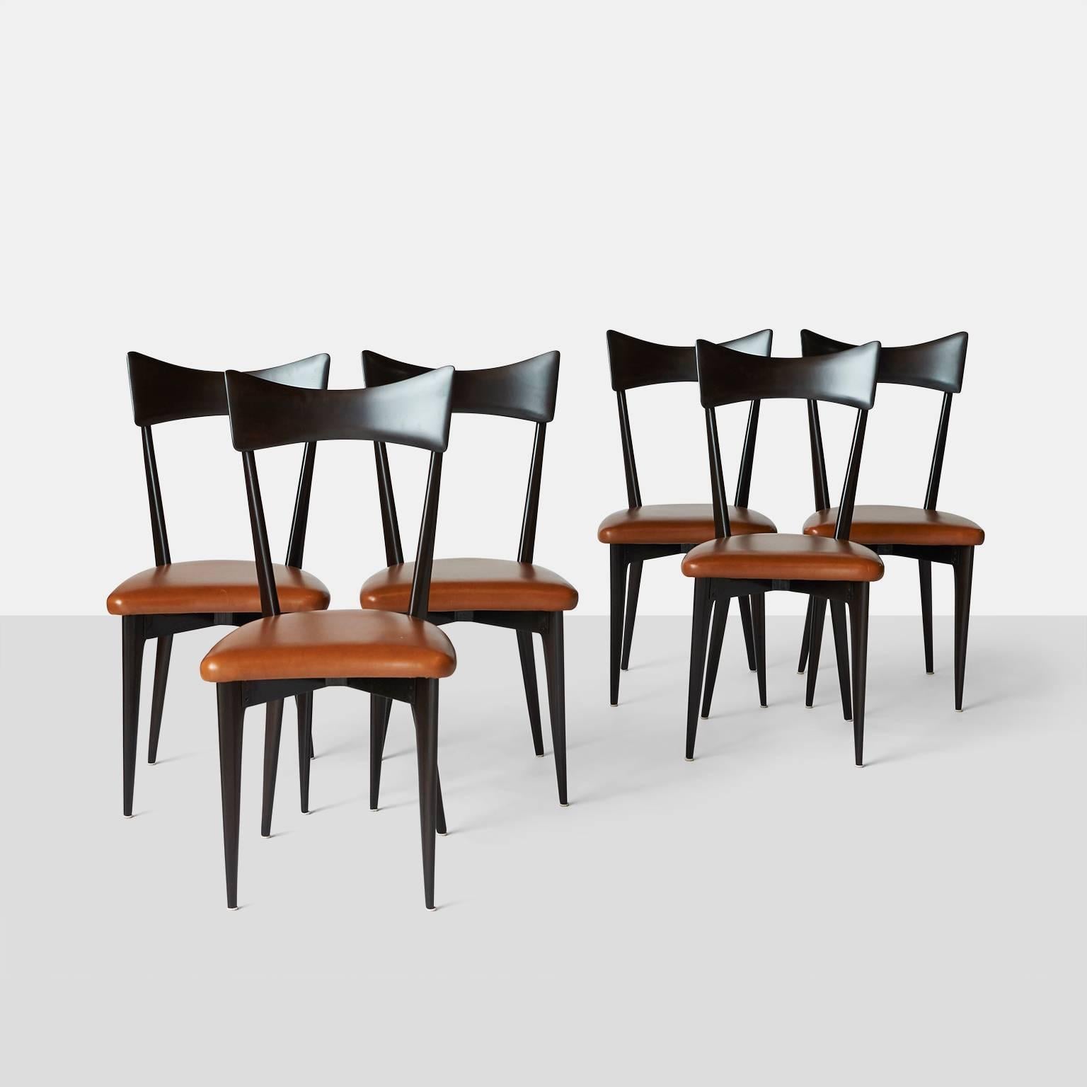 A set of six side chairs by Ico Parisi circa 1950 Italy made for Ariberto Colombo. Each chair is made in walnut with a blackened finish and maple color vinyl covered seat.

