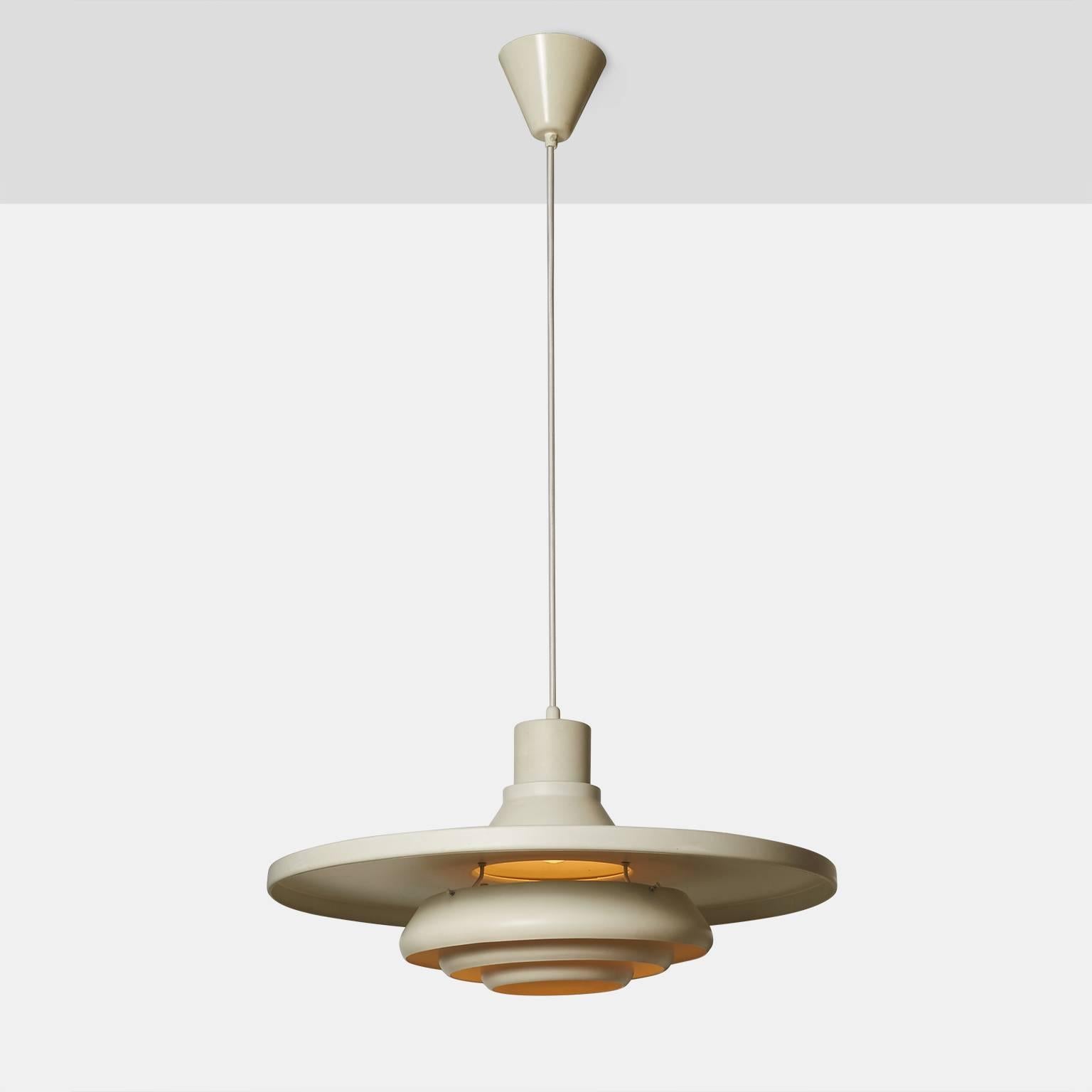 A very rare pendant by Alvar Aalto for Valaistustyö, Finland. The metal pendant has the original white lacquer finish and retains the mark Valaistustyö, circa 1954, Finland. The pendant has been rewired with a woven cloth cord.
