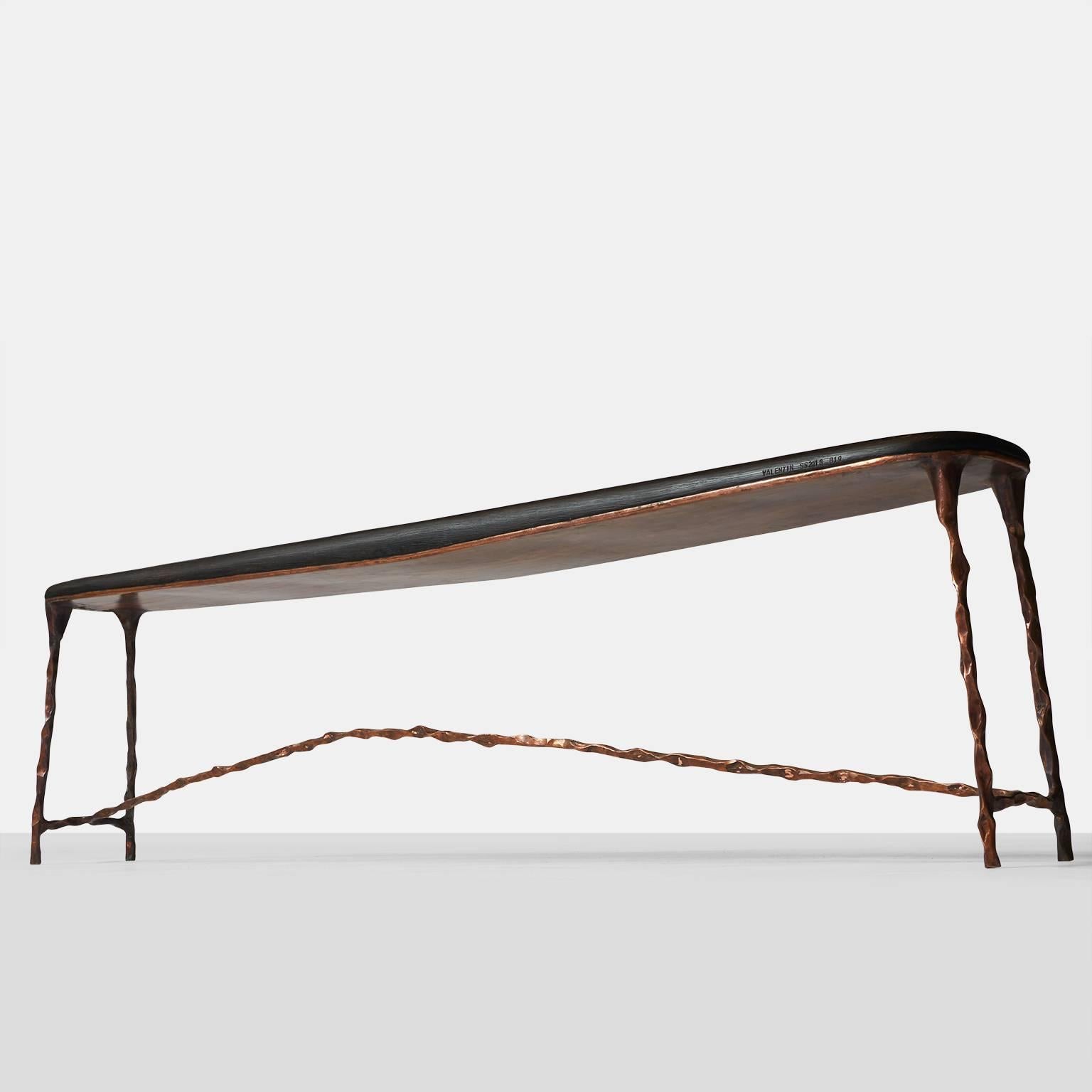 A large copper frame bench with a blackened oak seat. Completely handmade with all copper work being hand-forged with exceptional detail. 

Each piece is completely handmade by Valentin Loellmann, all are signed and numbered.  With all custom
