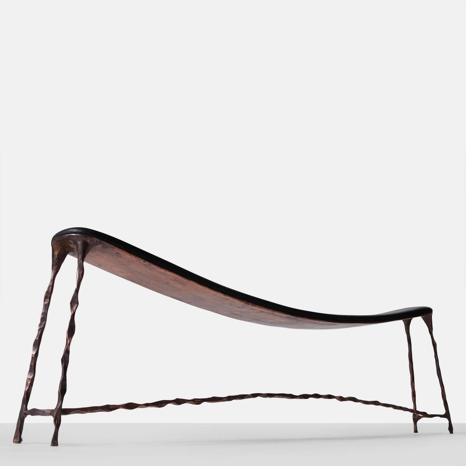 A large-scale bench with a bended and blackened oak top and a base of hand forged copper. Each piece is completely handmade by Valentin Loellmann and all are a limited edition, signed and numbered. Each piece is an original work of art.
Valentin