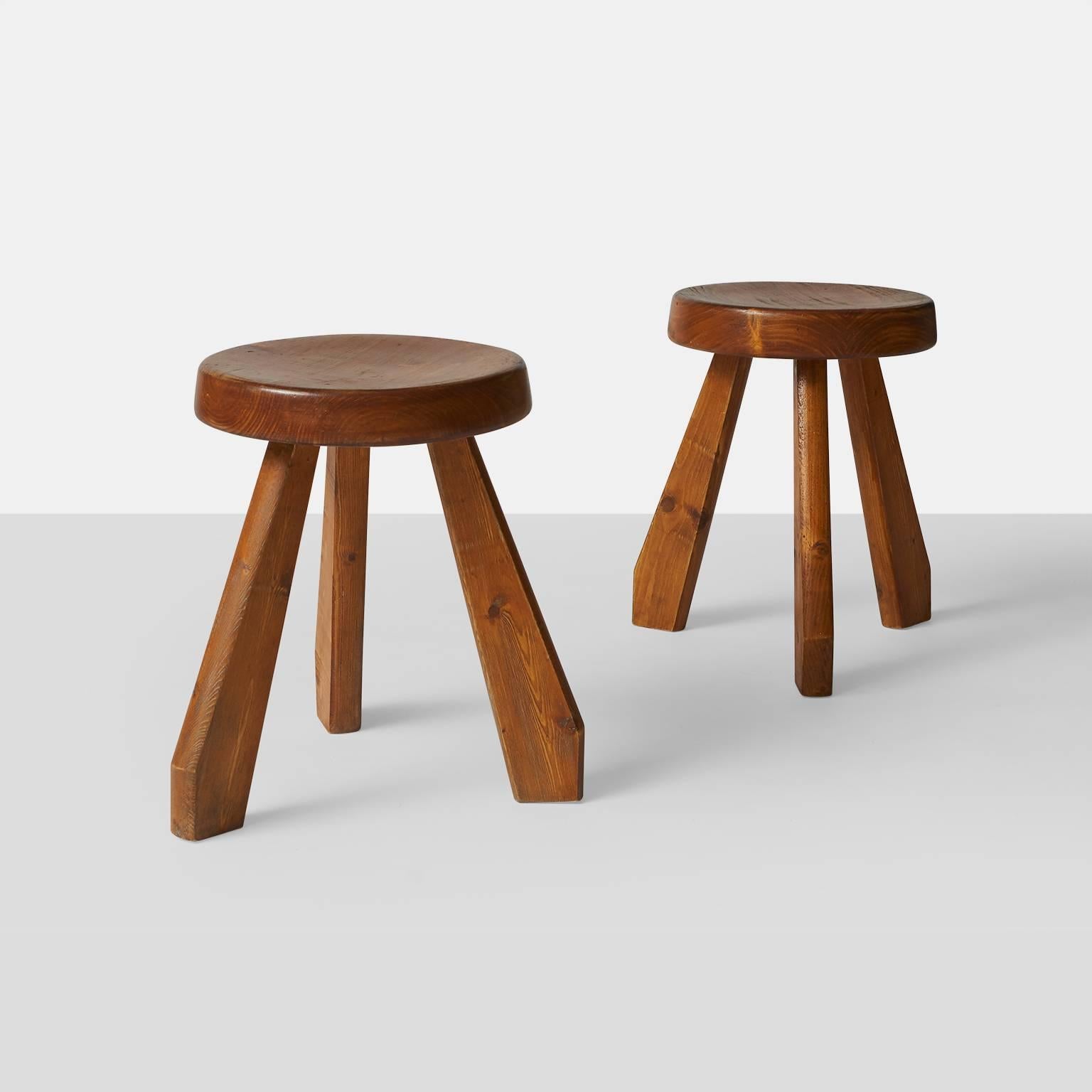 A pair of pine stools by Charlotte Perriand for Les Arcs ski resort in France with their original beautiful patina. Made in France, circa 1960.