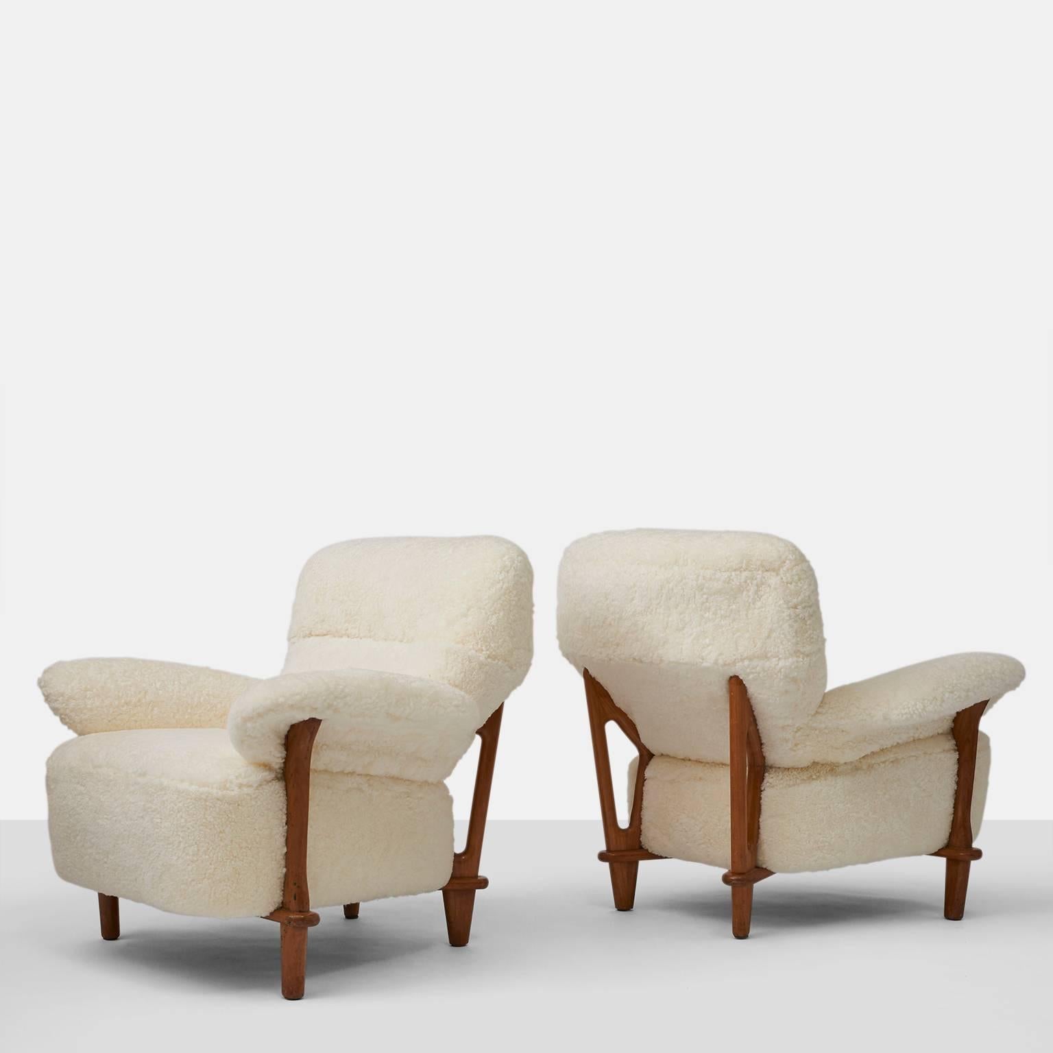 A rare pair of large scaled lounge chairs with a high back by Theo Ruth for Artifort, circa 1950. The chairs have been completely restored in a luxurious shearling.
 