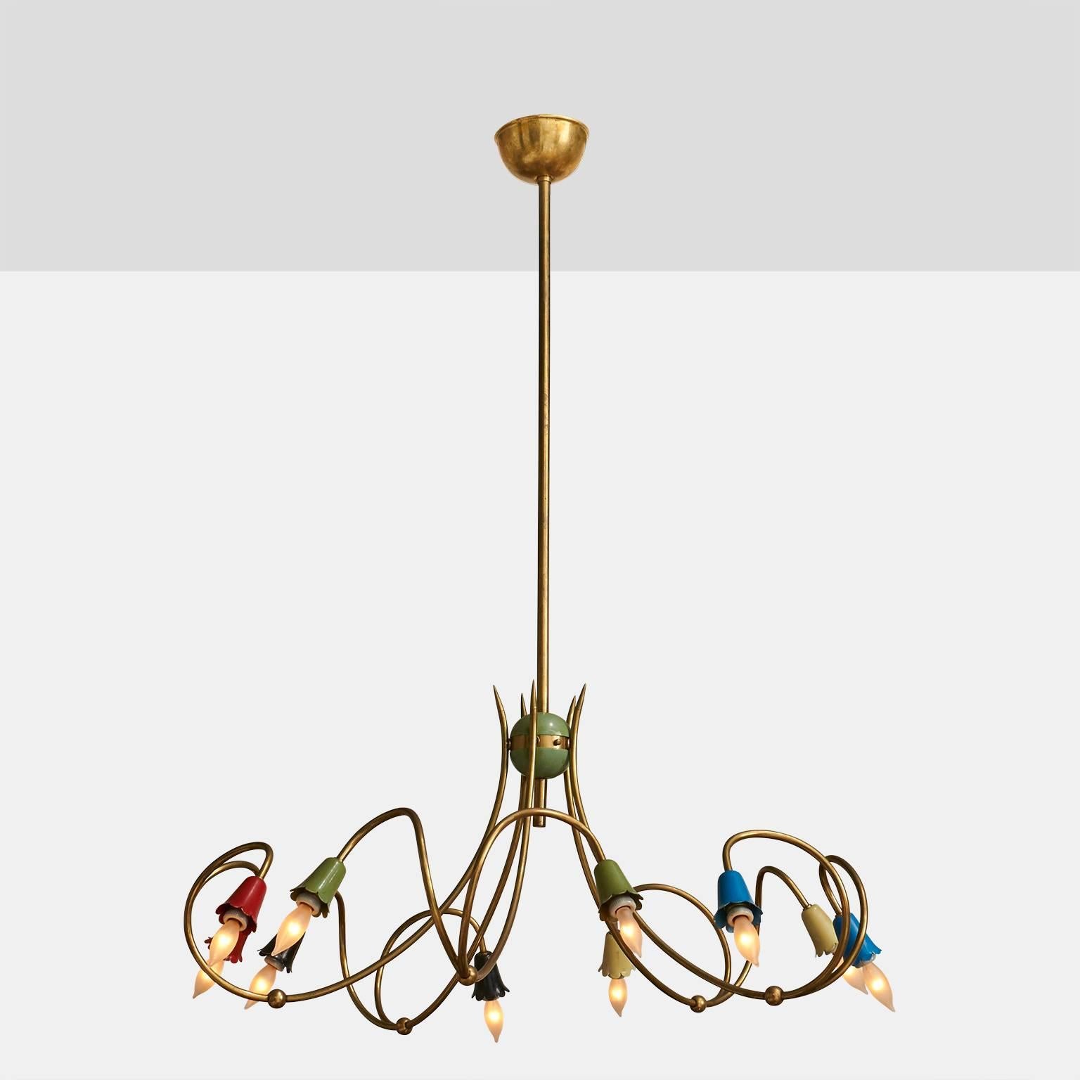 A brass chandelier with ten lights and red, olive and blue lacquered floral shaped caps, Italy, circa 1950s.