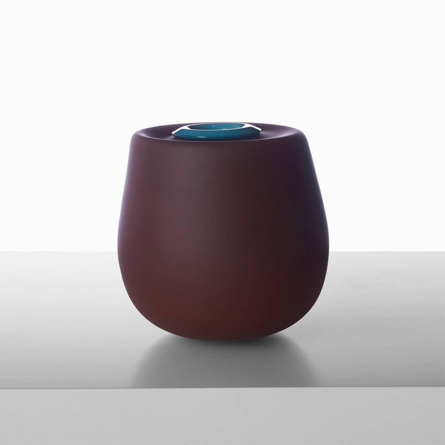 A large sculptural free hand blown glass vase entitled Void Incalmo in raw umber with a removable turquoise insert. Created by celebrated Parisian glass artist Jeremy Maxwell Wintrebert.