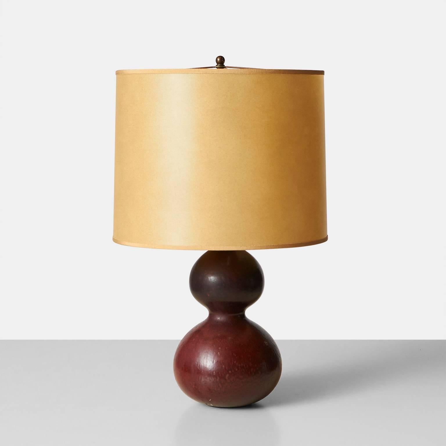 A double gourd shaped table lamp with a glaze in shades of brick and rose. Made by Axel Salto in the Royal Copenhagen studio. Signature etched on the bottom, Denmark, circa 1950.

 