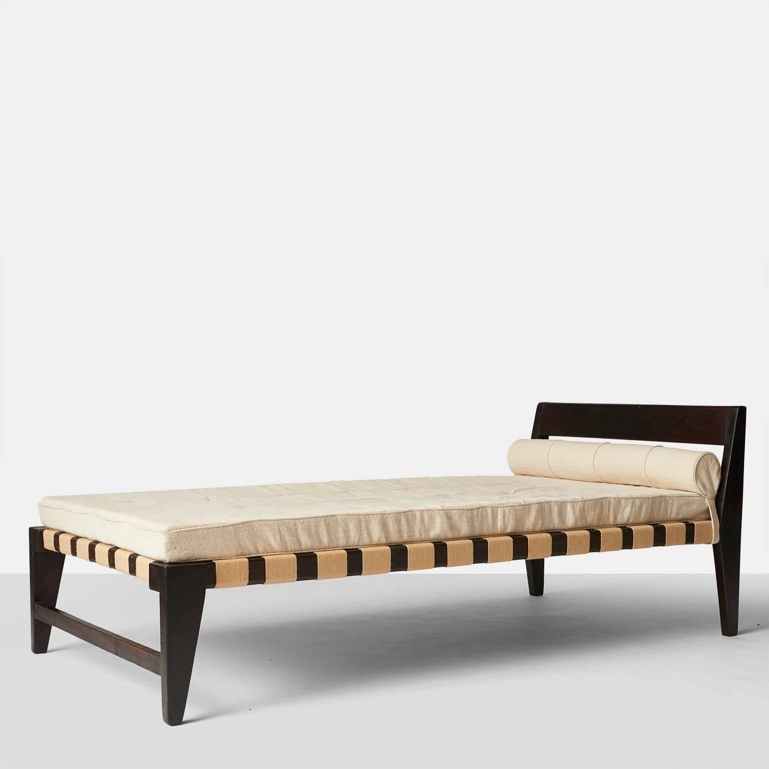 A daybed by Pierre Jeanneret from Chandigarh India made in 1955. The frame is in teak with a dark stain finish and cushion upholstered in a natural color linen.
Provenance: Chandigarh, India Private collection, Paris.
 