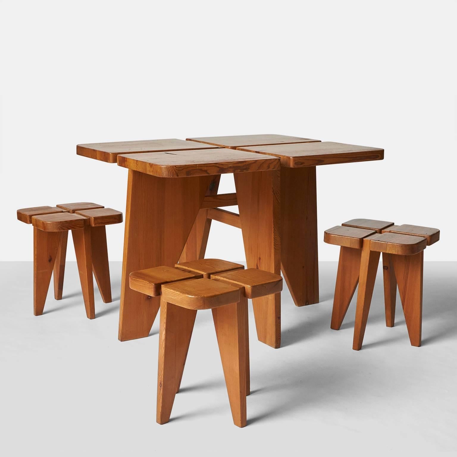 A dining table and four stools in pine, by Lisa Johansson-Pape for Stockman Orno, Finland, 1960s.
Each stool measures 14