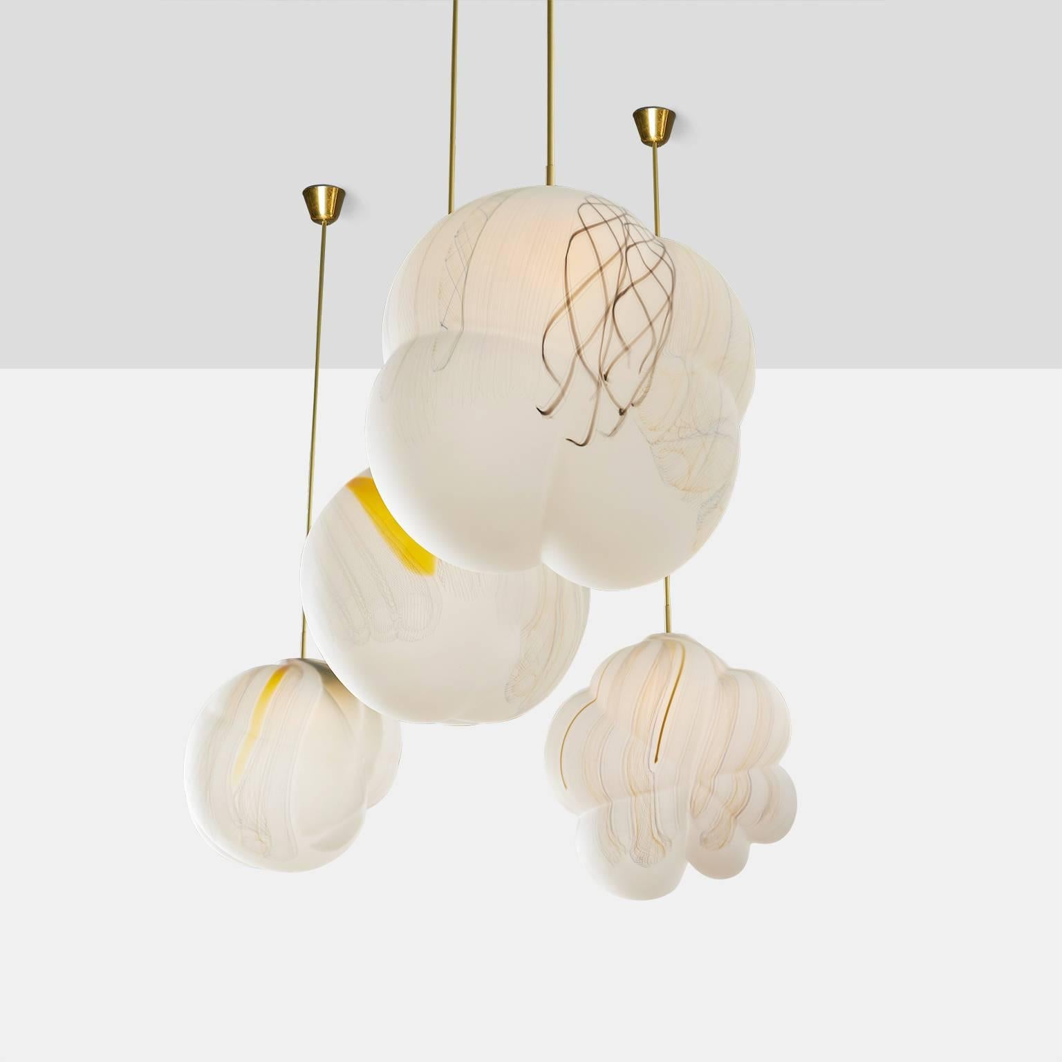 A collection of free handblown glass cloud shaped pendants with an inlaid pattern of colored glass. Each is one of a kind and features a unique installation with built in LED chip.
Almond & Company is the exclusive gallery in the U.S. to represent
