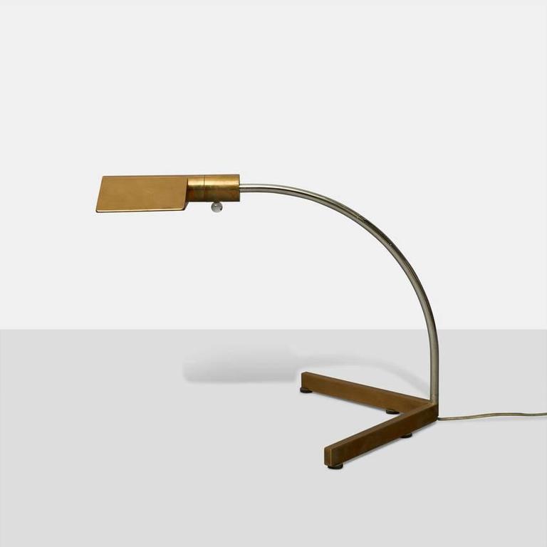 A desk lamps in solid brass and chrome with Lucite dimmer switch. Stamped to the base: 