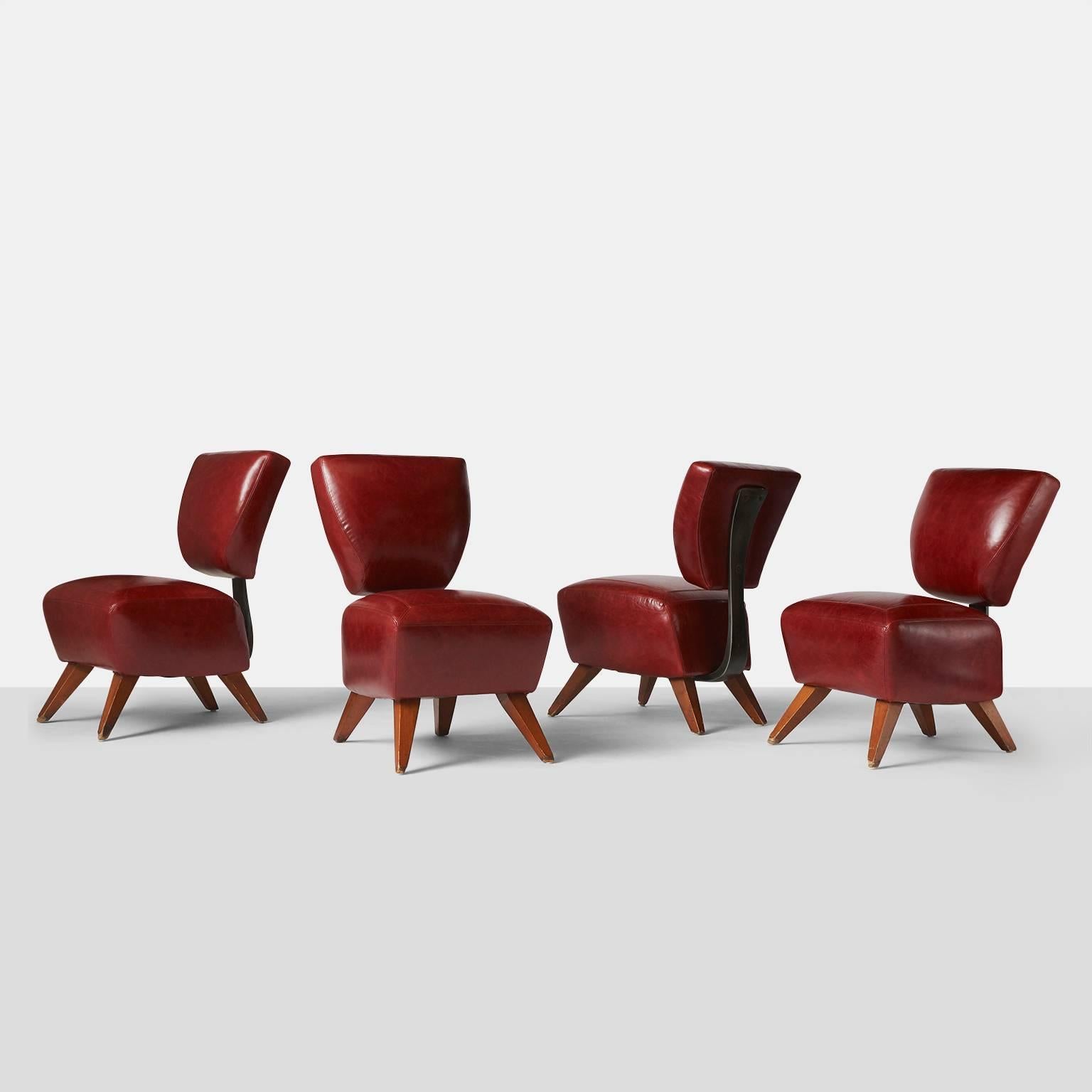 Four rare dining chairs restored in a luxurious red leather and using a molded steel plate running from under the seat to secure the back. The Fred chair was designed for the Barney’s Flagship store in NYC, 
USA, circa 1990s.