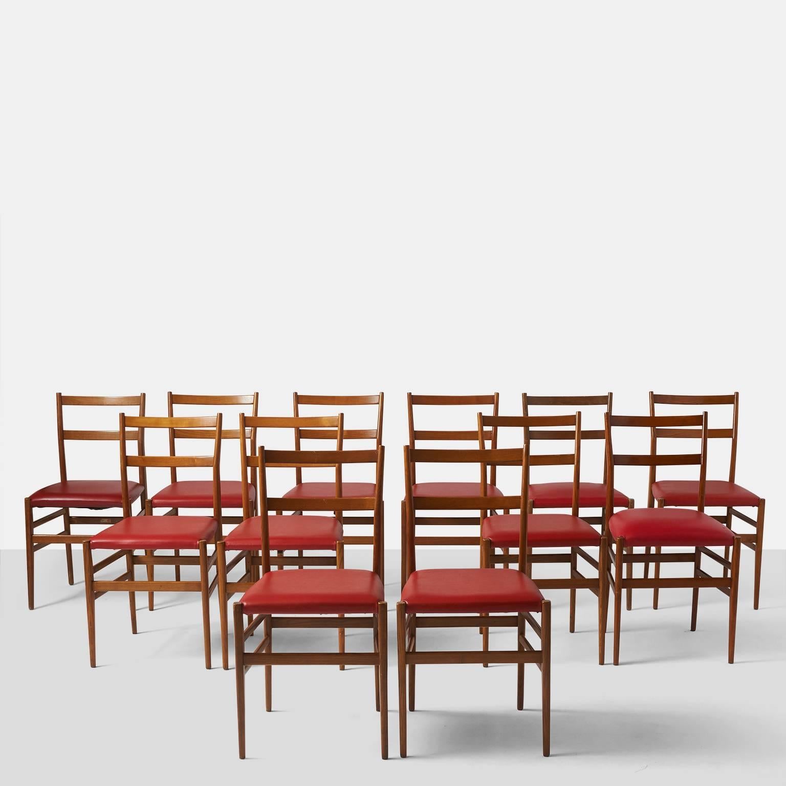 A set of 6 Leggera chairs by Gio Ponti for Cassina retaining the original labels. The seats have been upholstered in a deep red faux leather and the ash is in a medium tone.
Note: Chairs are priced and sold as a set of 2 chairs.