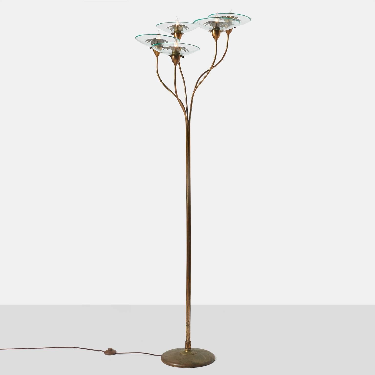 A very rare and documented five-light floor lamp with a floral branch detail in brass with glass bulbash and hand-cut brass leaf rosettes all in a rich natural aged brass patina.
Documented in the book 