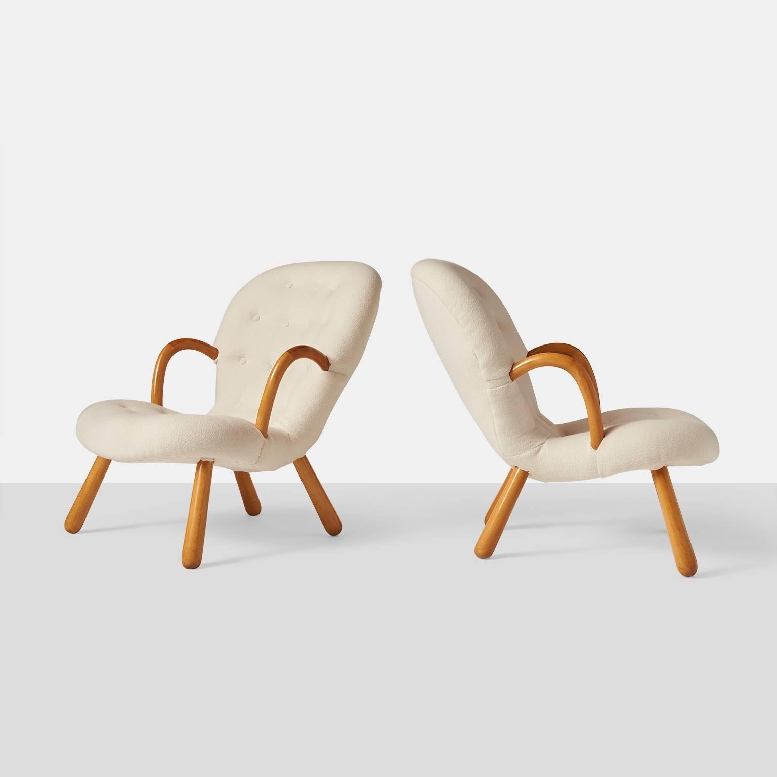 A pair of lounge chairs by Philip Arctander for Nordisk Staal-Mobel, Denmark, circa 1944. The chairs have been restored using a luxuriously soft wool bouclé fabric from Holland & Sherry.

  