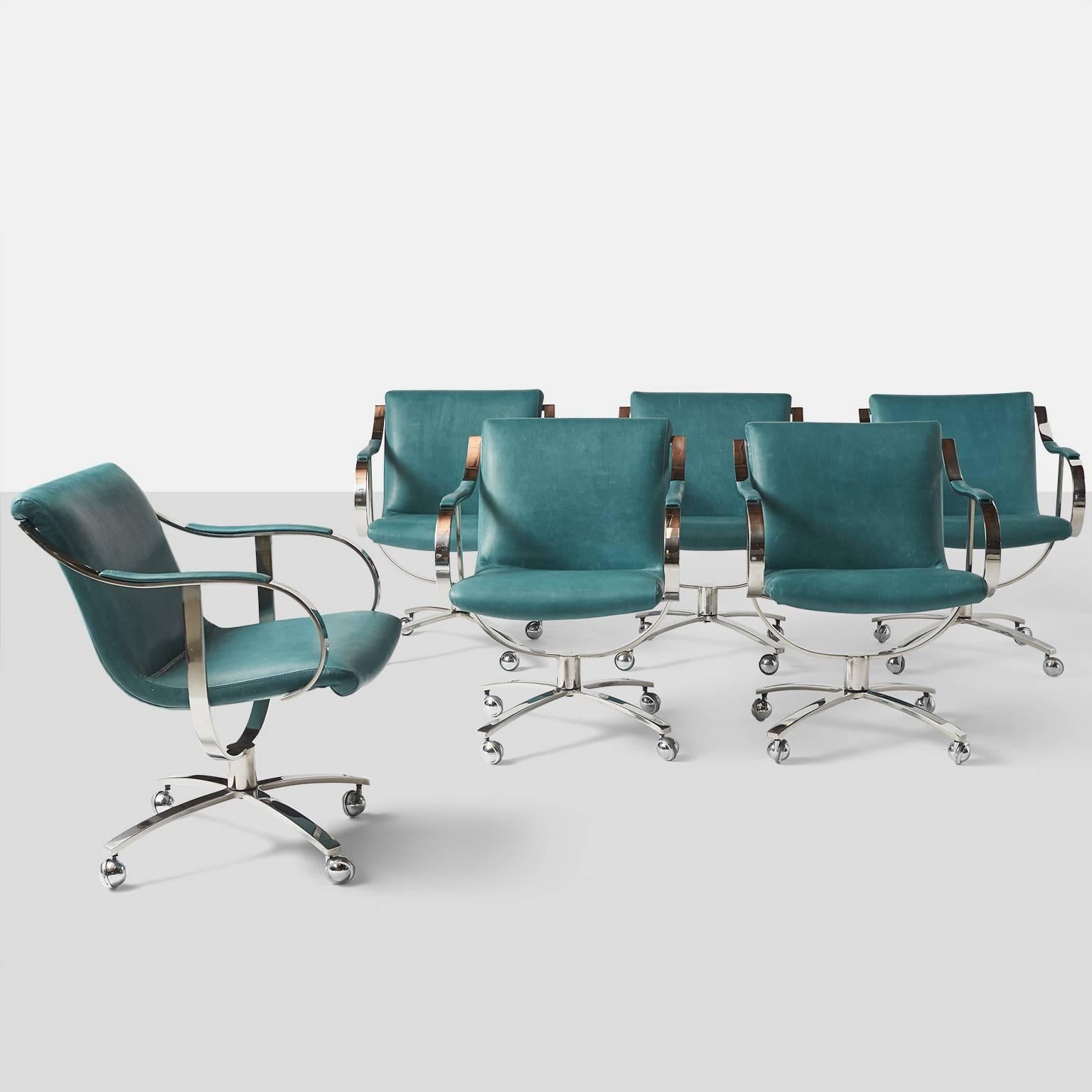 A set of six swivel chairs series #455 restored in a blue leather on chromed steel frames and four castered legs.
USA, circa 1970s.