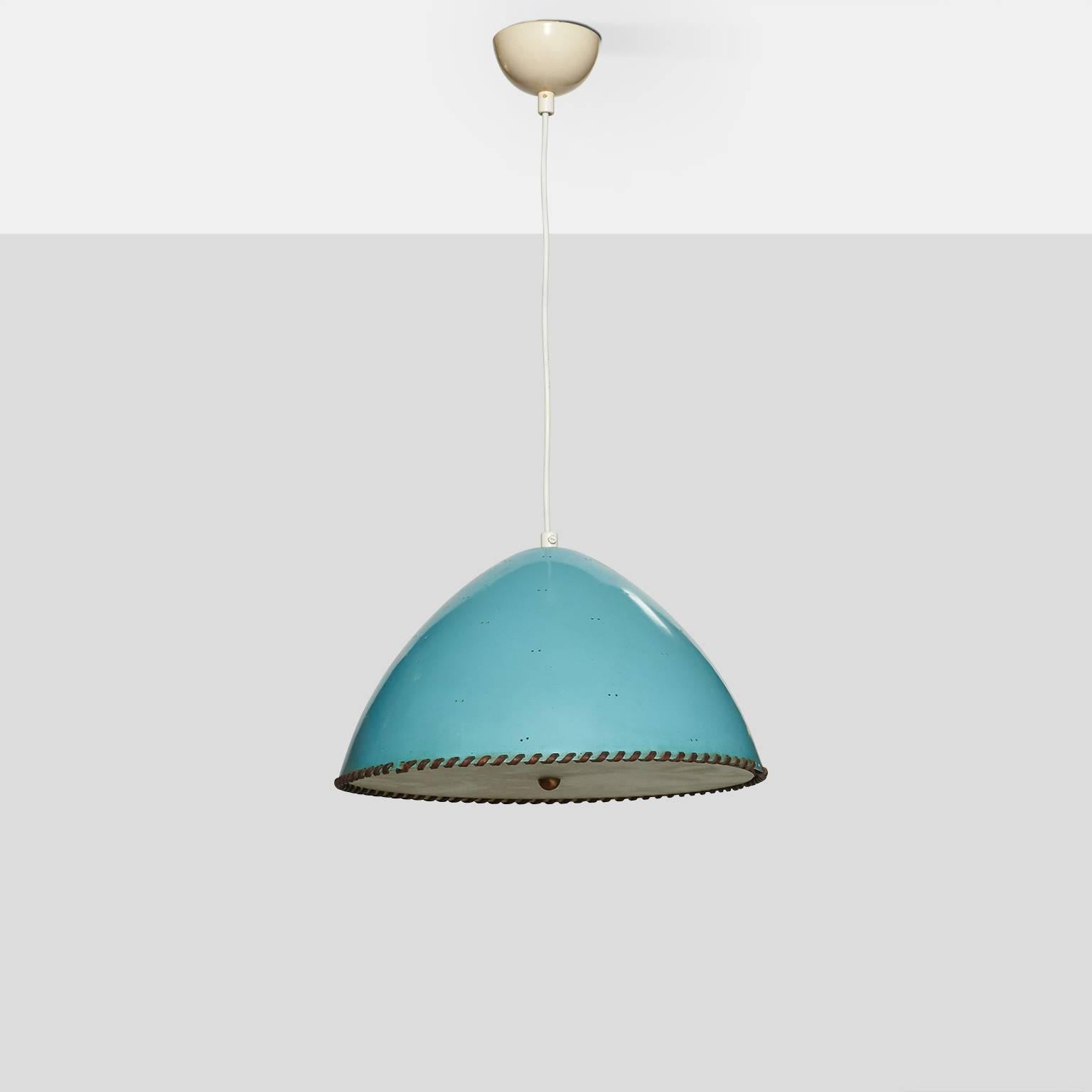 A chandelier by Paavo Tynell in pale blue enameled steel with perforated shade, leather trimmed edge, etched glass diffuser and a brass finial. The overall drop can be easily adjusted.
Finland, circa 1950s.