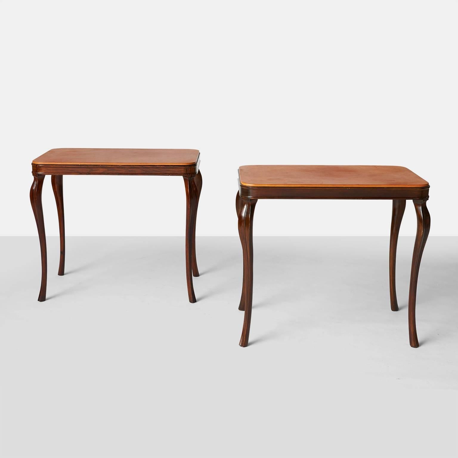 A pair of mahogany framed side tables with 