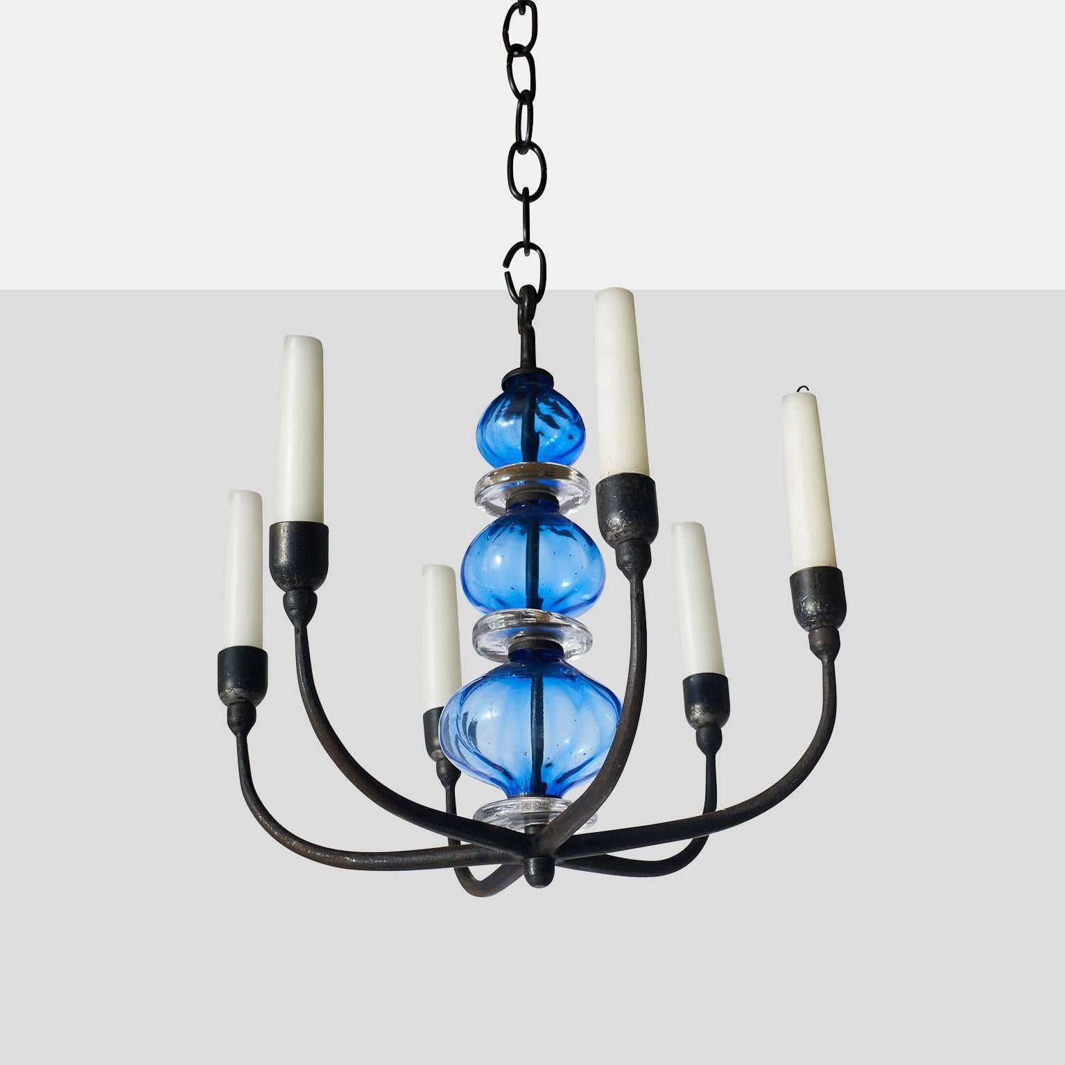 Erik Hoglund Iron chandelier with six arms for candles. Handmade strain and glass in shades of blue and clear from Kosta Boda.
Erik Hoglund for Kosta Boda,
Denmark, circa 1960s.