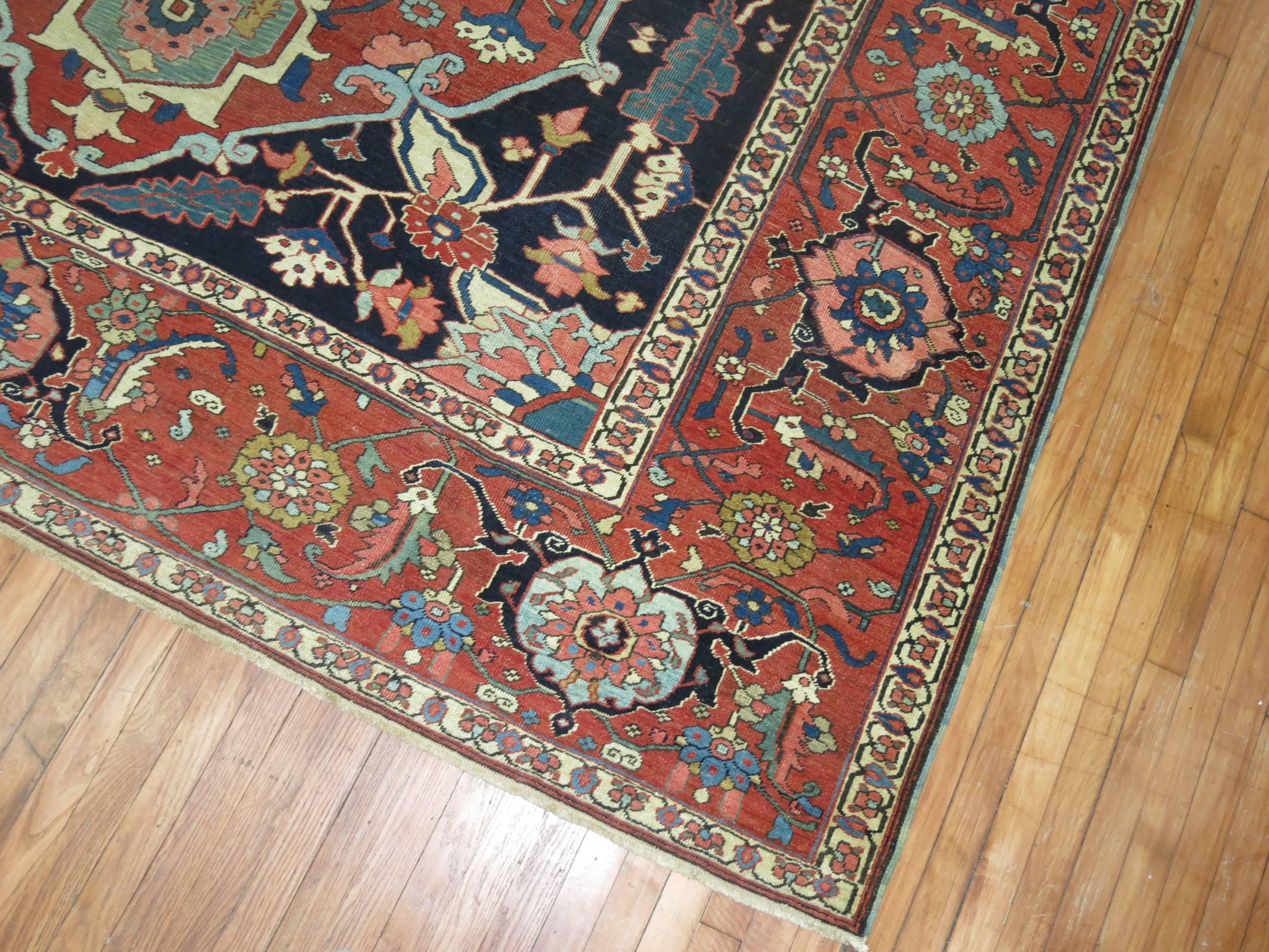 An authentic late 19th century antique Persian Serapi rug.

Antique Serapi carpets were woven on the level of a family or small workshop with multiple weavers working several years to complete each Persian rug. The weaving was done almost