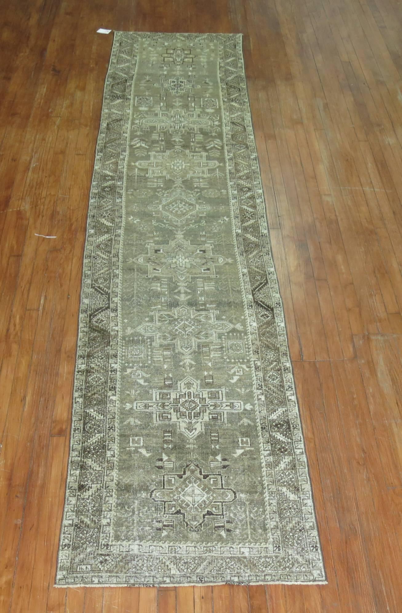 A weather textured geometric Persian Heriz runner with shades of silver we seldom find. Other Accents in charcoal, green and browns.