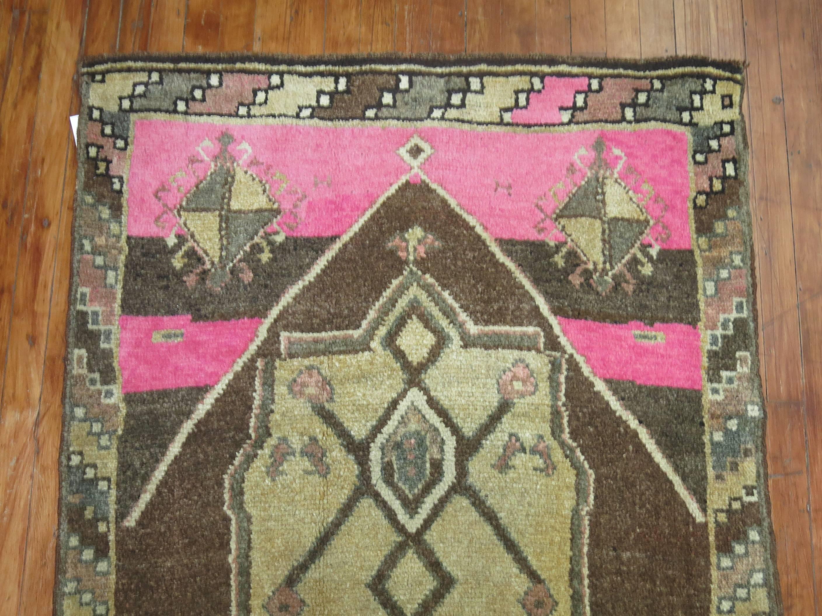 A Turkish Kars runner with an unusual shade of bright pink on one end with shades of pink found in the border and field.

3'5'' x 11'7''

Kars is a village located in Northeast of Turkey. The weavers in this area tend to make long runners and long