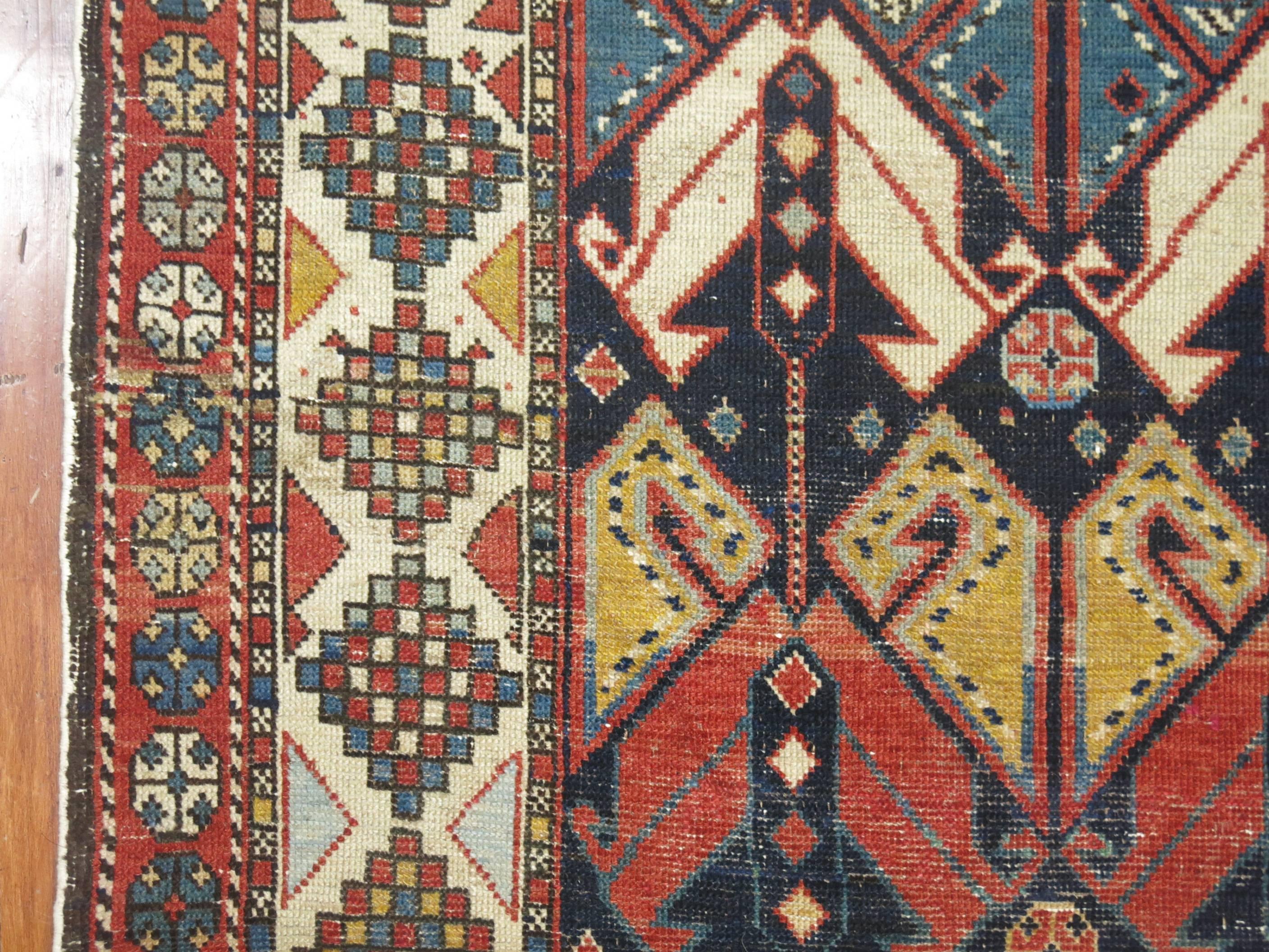 An authentic early 20th century one of a kind decorative style antique Caucasian Shirvan rug.