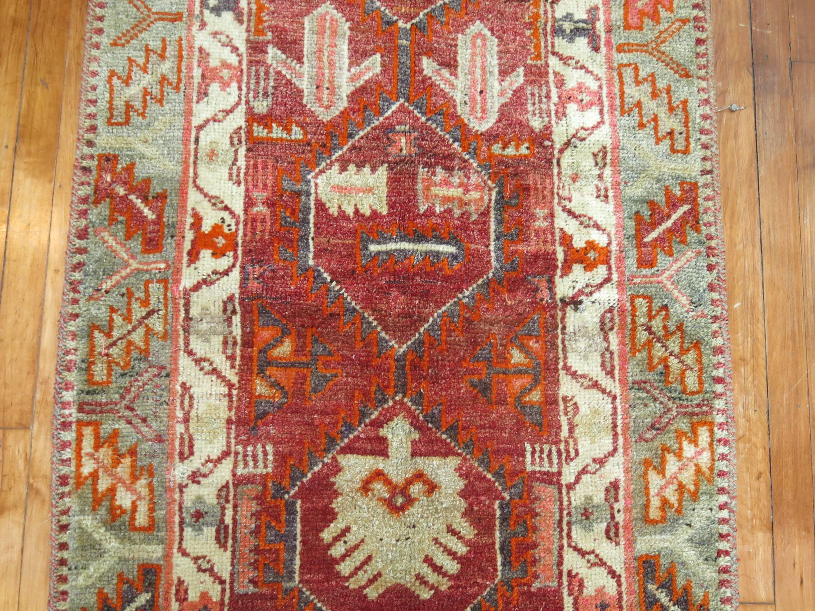 Vintage one of a kind Armenian runner with predominant accents in brown, burgundy and green on all-over design.

Measures: 2'11