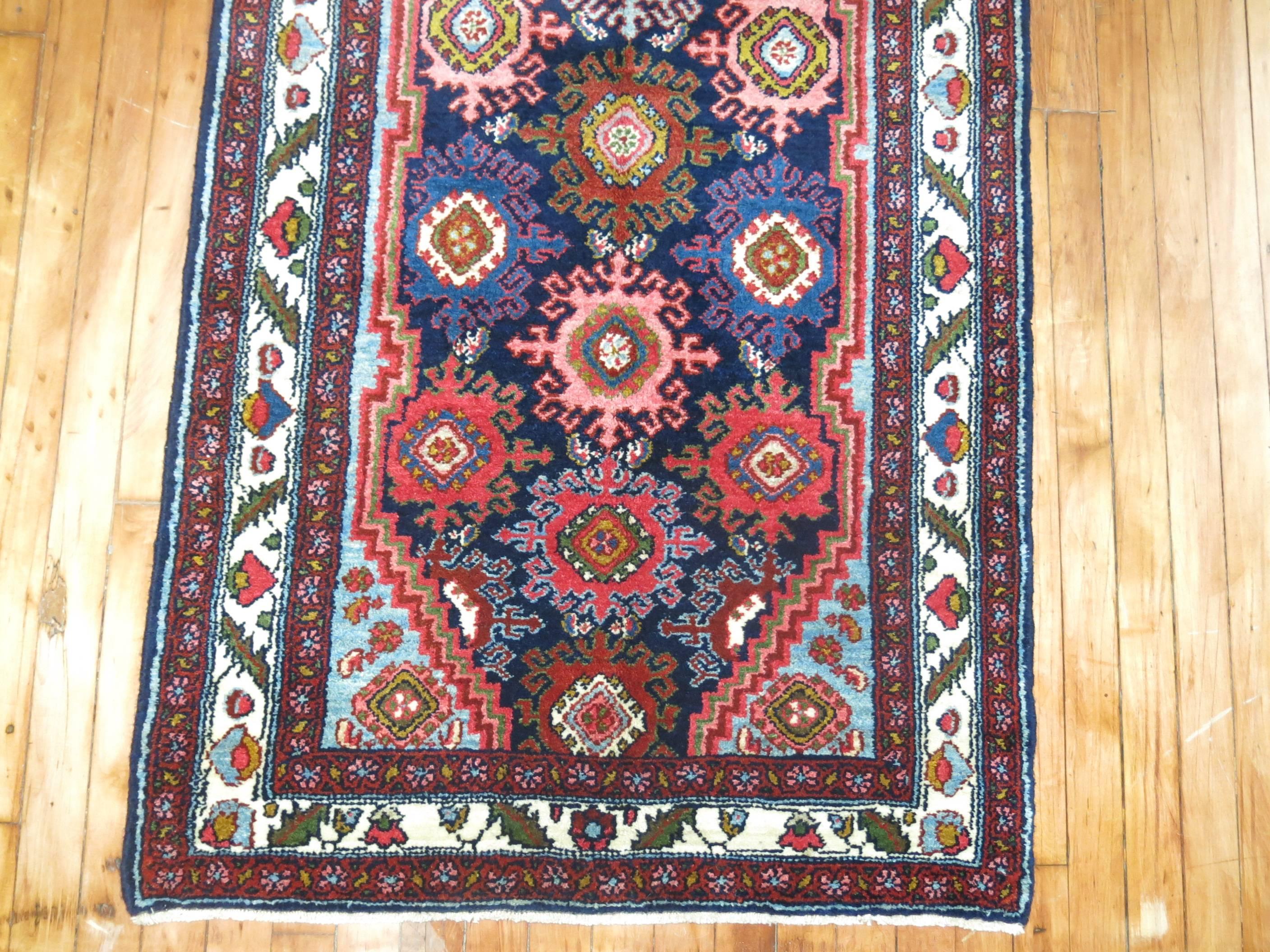 Rare long and narrow Persian Hamadan Runner in jewel tones.

Hamadan is a city situated in the western part of Iran, 300 kms west of Teheran. It is one of the worlds oldest cities and is mentioned under the name of Ekbatana in the Bible, see the