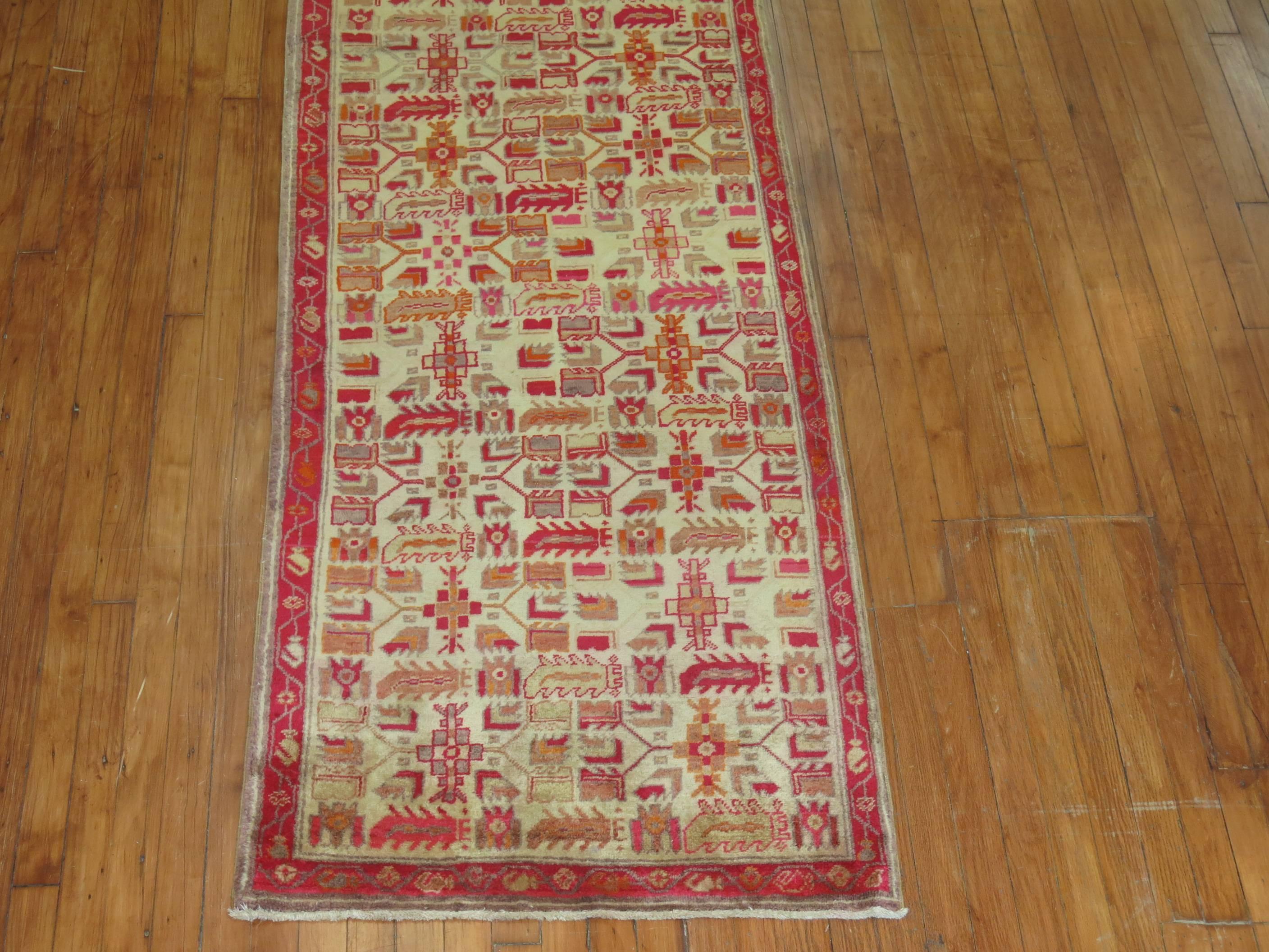  A Turkish runner with predominant accents in red, orange, and ivory from the mid-20th century

measures: 2'8