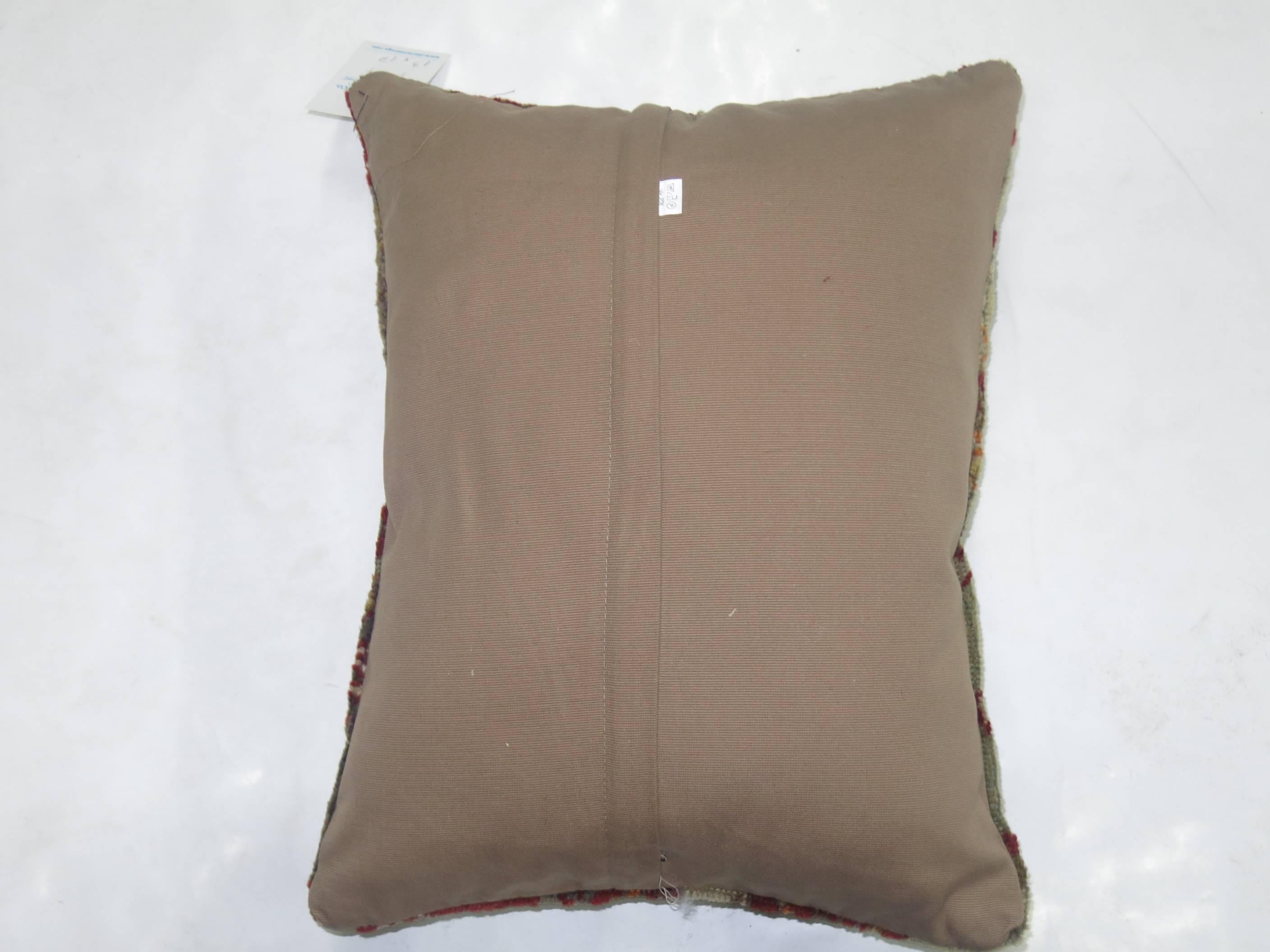 Pillow made from a 20th century antique Turkish Sivas rug with cotton back. Zipper closure.