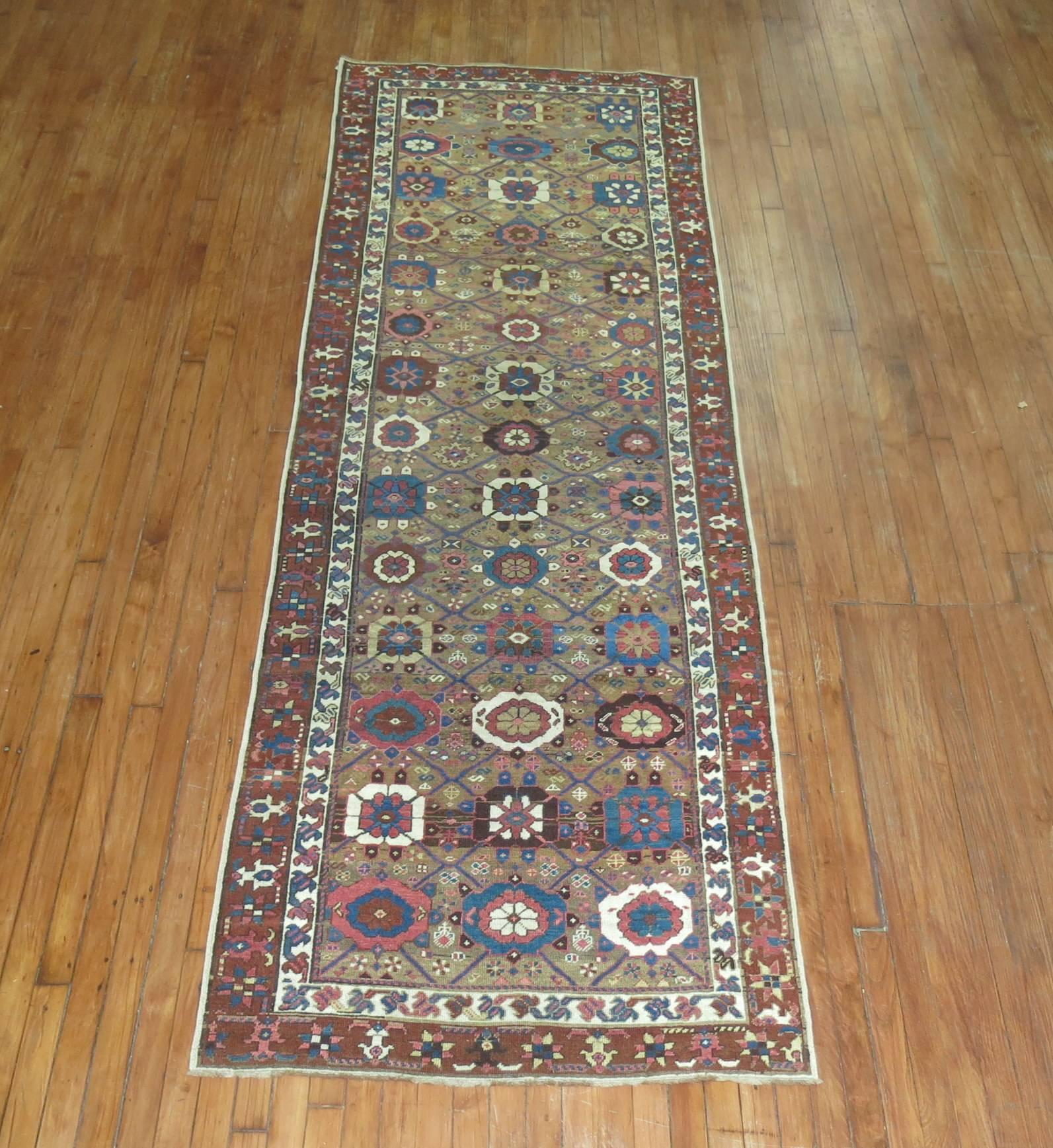 Northwest Persian runner, possibly from Bakshsaish Region with an all-over mini-khani motif set on a camel brown ground.

Measures: 3'5'' x 10'4''.